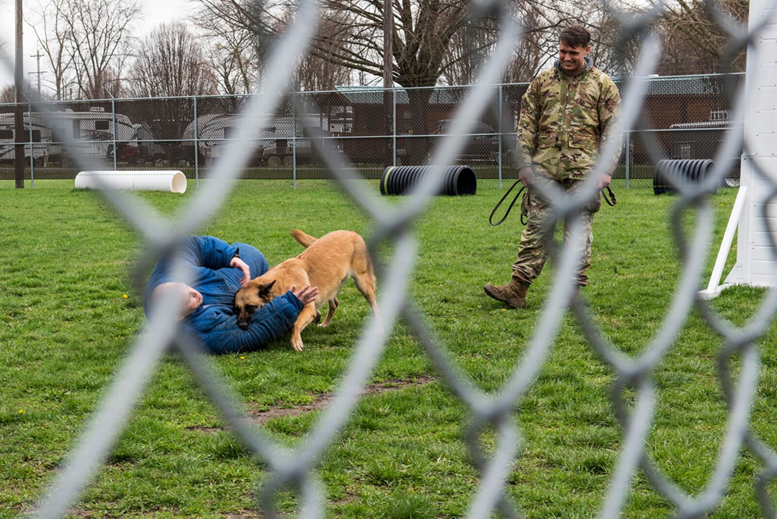 Canine handlers from the 88th Security Forces Squadron’s military working dog group conduct a demonstration for members of Leadership Dayton April 13 at Wright-Patterson Air Force Base. U.S. AIR FORCE PHOTO/JAIMA FOGG