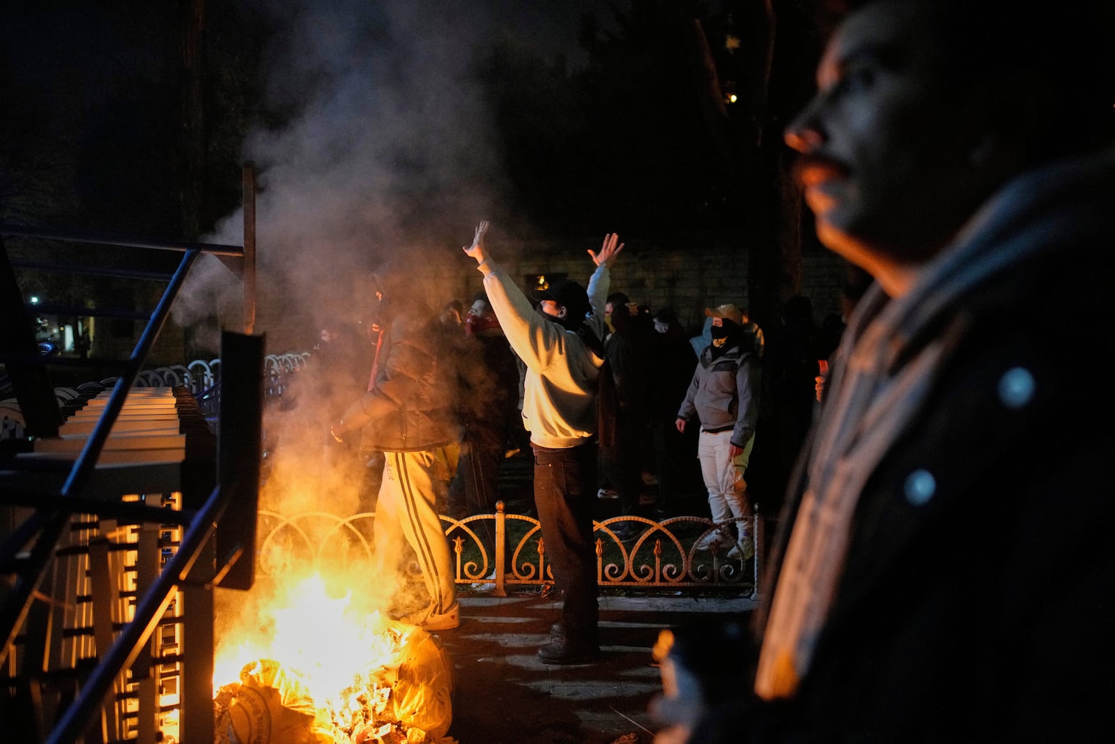 Protesters shout slogans during clashes with anti riot police during a protest against the arrest of Istanbul's Mayor Ekrem Imamoglu in Istanbul, Turkey, Friday, March 21, 2025. (AP Photo/Emrah Gurel)