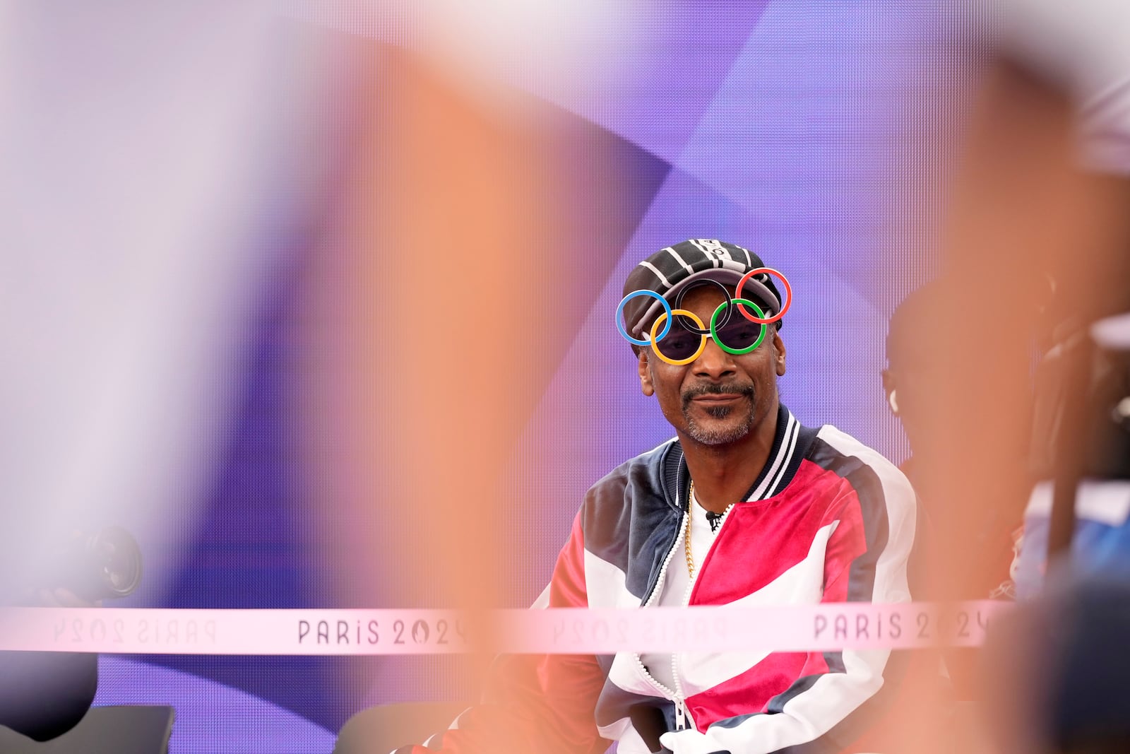 FILE - U.S. artist Snoop Dogg sits in the audience before the breaking competition at La Concorde Urban Park at the 2024 Summer Olympics, Aug. 9, 2024, in Paris, France. (AP Photo/Frank Franklin, File)