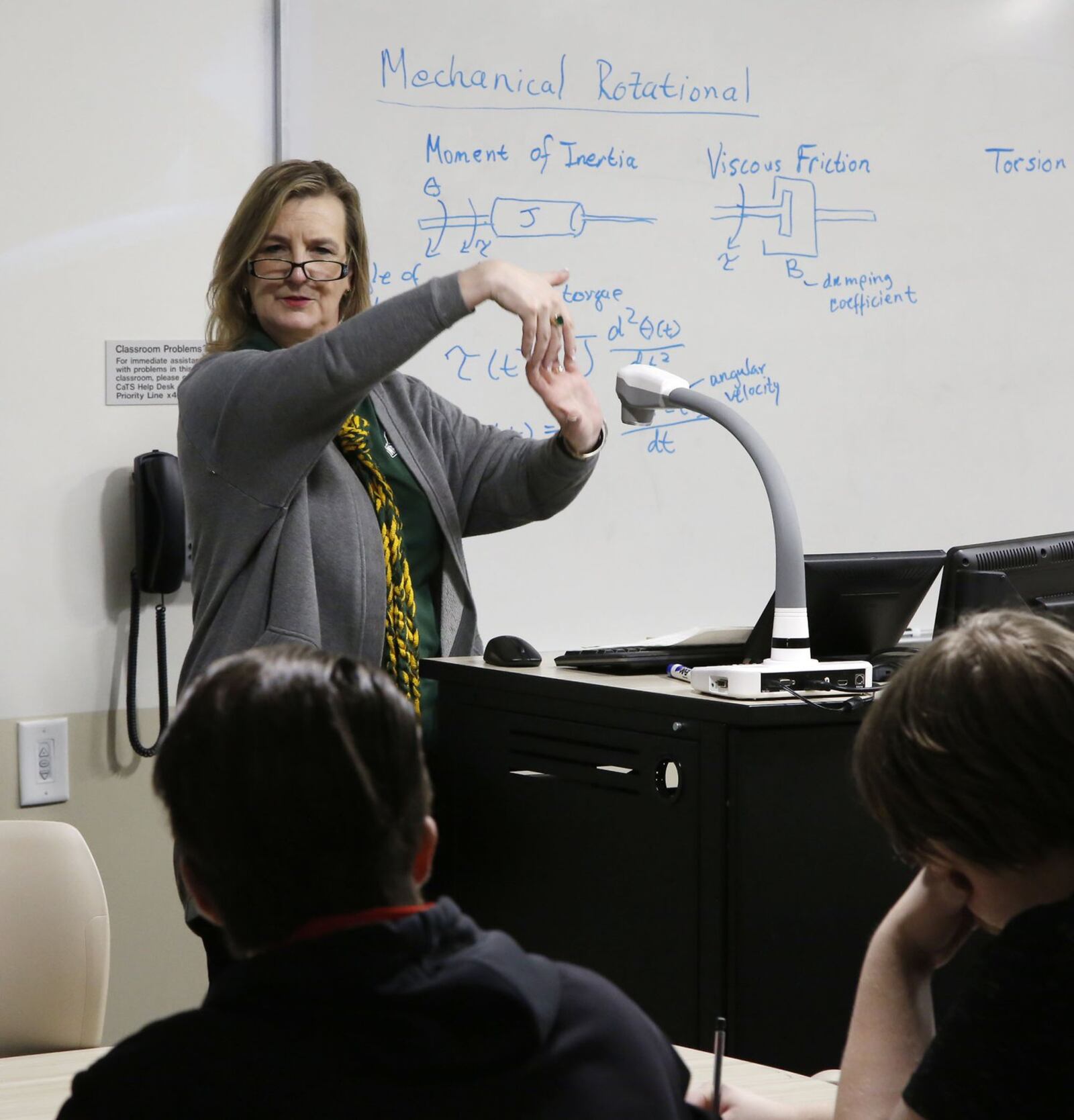 Wright State University president Cheryl Schrader taught an engineering class on Thursday as striking professors picketed in front of campus and students held a sit-in at her office front door. TY GREENLEES / STAFF