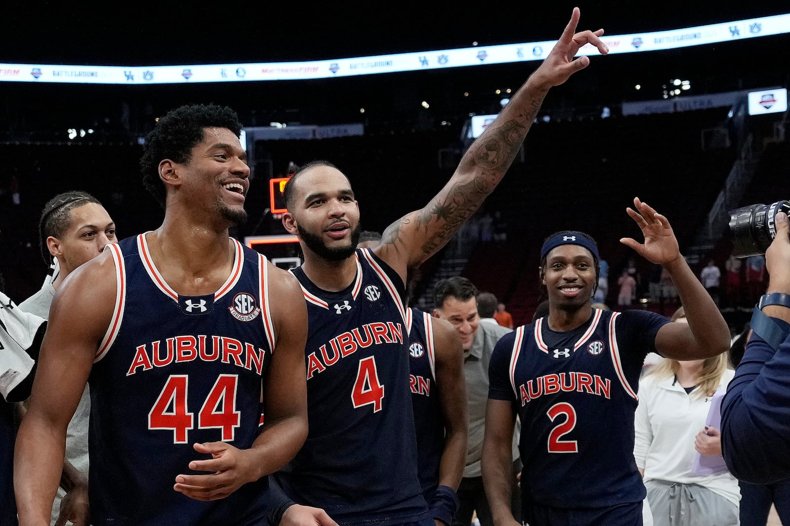 Auburn center Dylan Cardwell (44), forward Johni Broome (4) and guard Denver Jones (2) celebrate after an NCAA college basketball game against Houston Saturday, Nov. 9, 2024, in Houston. (AP Photo/Kevin M. Cox)