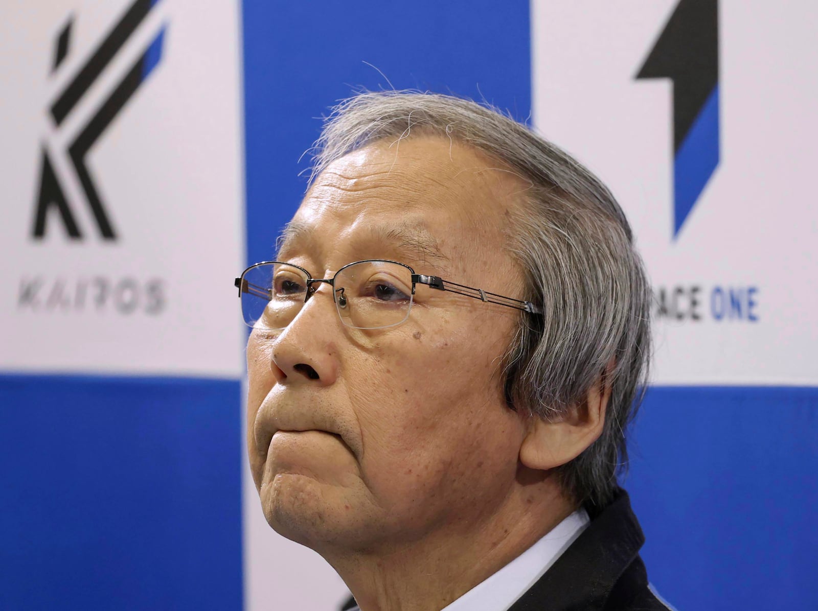 Space One President Masakazu Toyoda reacts during a press conference after its second attempt to launch the Kairos No. 2 rocket carrying satellites into orbit had been aborted minutes after liftoff, in Kushimoto town, western Japan Wednesday, Dec. 18, 2024.(Kyodo News via AP)