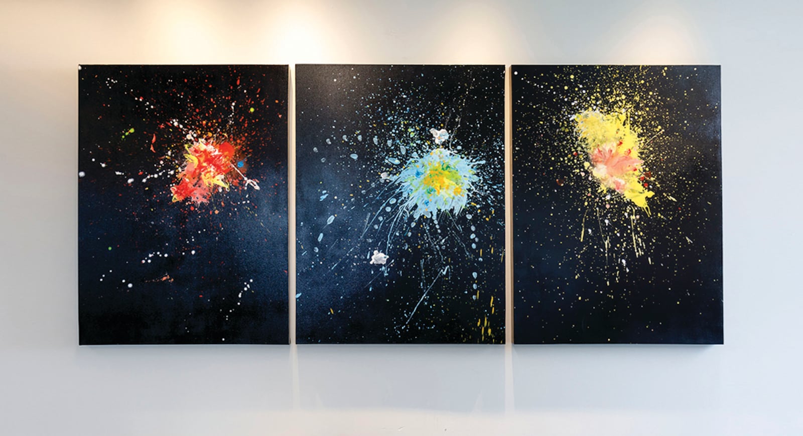 Artist Ron Rollins was inspired by the DAI's French painting, "Dinner at the Casino," a depiction of erupting fireworks. His three-panel painting, "And Then the Rockets Traced the Edges of the Night," suggests "how the library contains explosions of ideas for all to discover."