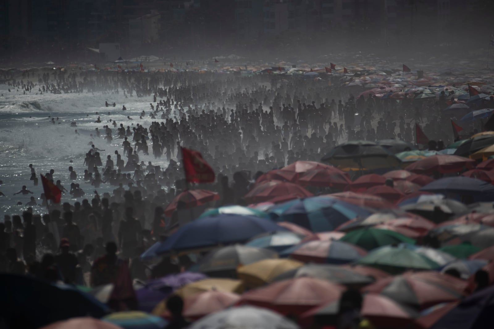 People flock to Ipanema beach during summer in Rio de Janeiro, Sunday, Feb. 16, 2025. (AP Photo/Bruna Prado)