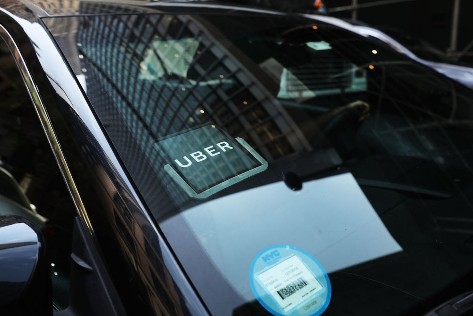 NEW YORK, NY - JUNE 14:  An Uber car waits for a client in Manhattan a day after it was announced that Uber co-founder Travis Kalanick will take a leave of absence as chief executive on June 14, 2017 in New York City. The move came after former attorney general Eric H. Holder Jr. and his law firm, Covington & Burling, released 13 pages of recommendations compiled as part of an investigation of sexual harassment at the ride-hailing car service.  (Photo by Spencer Platt/Getty Images)