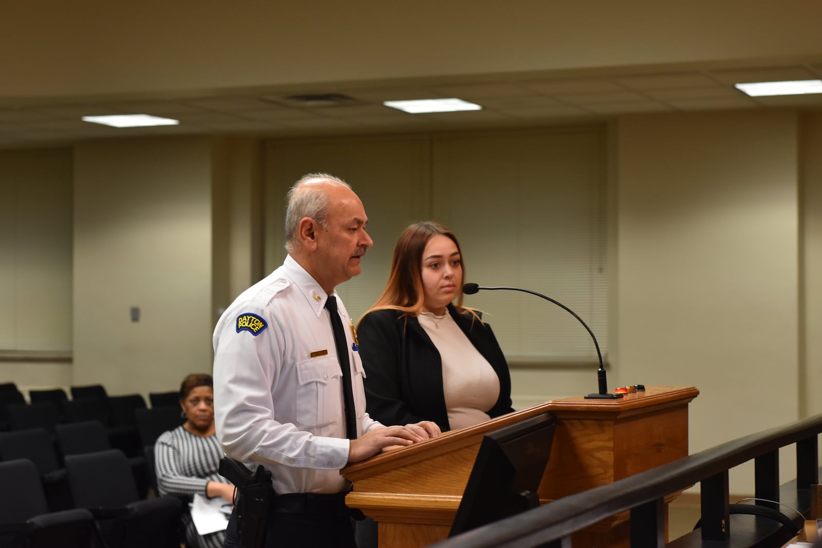 Dayton police Chief Kamran Afzal thanked Savannah Shediack for saving a Dayton police recruit's life in October after he was injured during an automobile crash. Shediack, 28, of Springfield, was honored at City Hall on Wednesday for her actions that day. CORNELIUS FROLIK / STAFF