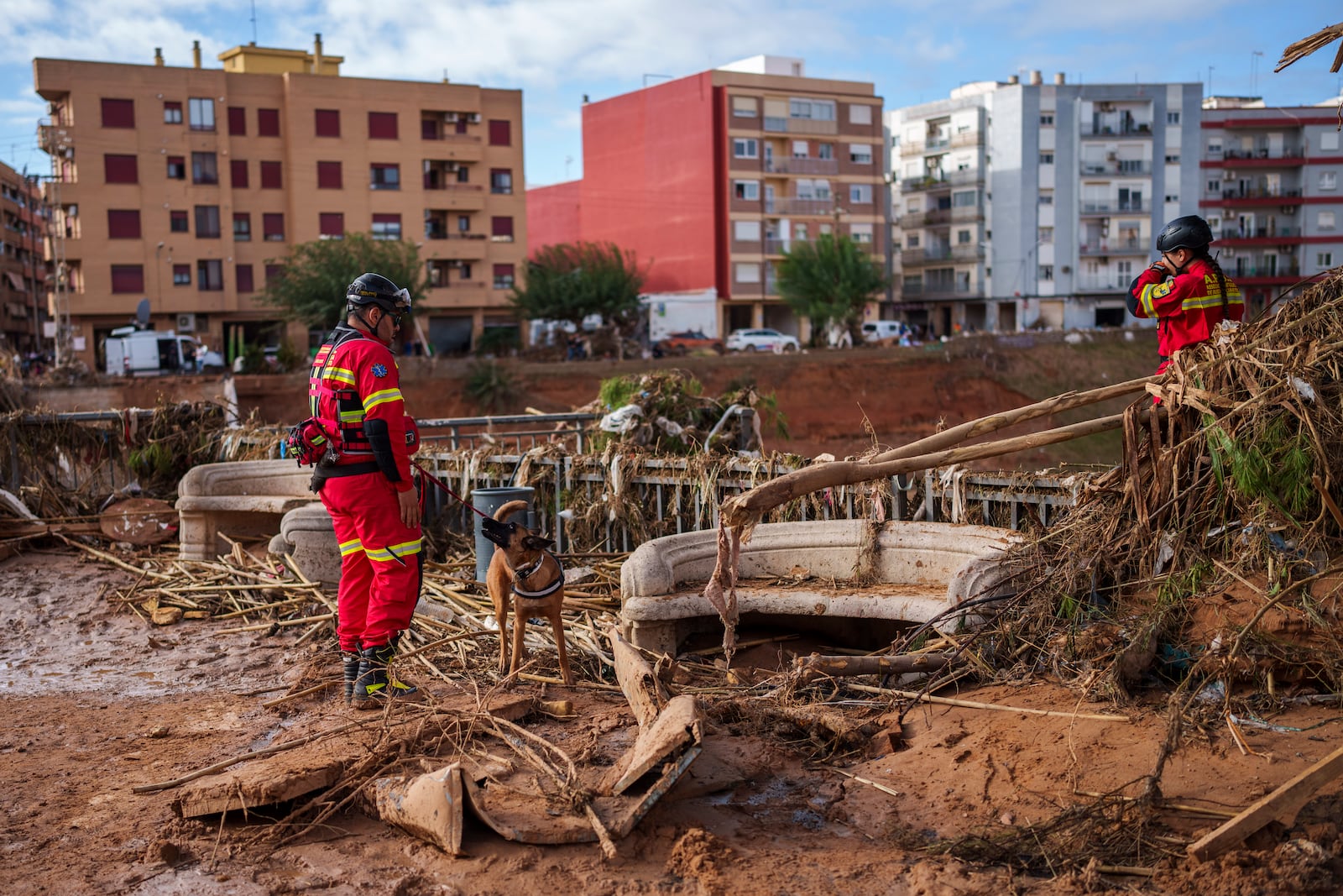 Emergency service work in an area affected by floods in Valencia, Spain, Saturday, Nov. 2, 2024. (AP Photo/Manu Fernandez)