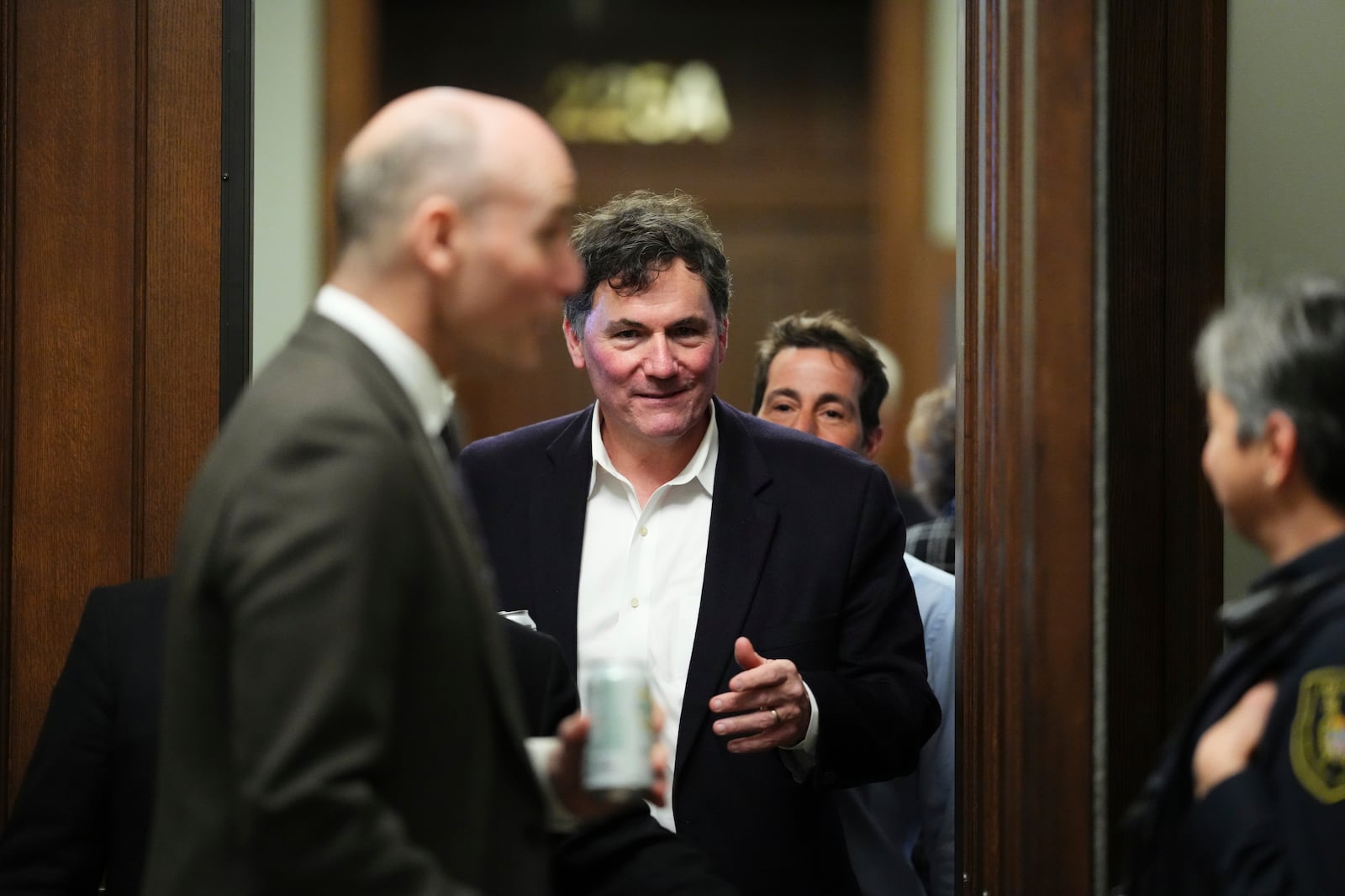 Finance Minister Dominic LeBlanc leaves during a break in a Liberal caucus meeting in Ottawa on Wednesday, Jan. 8, 2025. (Sean Kilpatrick/The Canadian Press via AP)