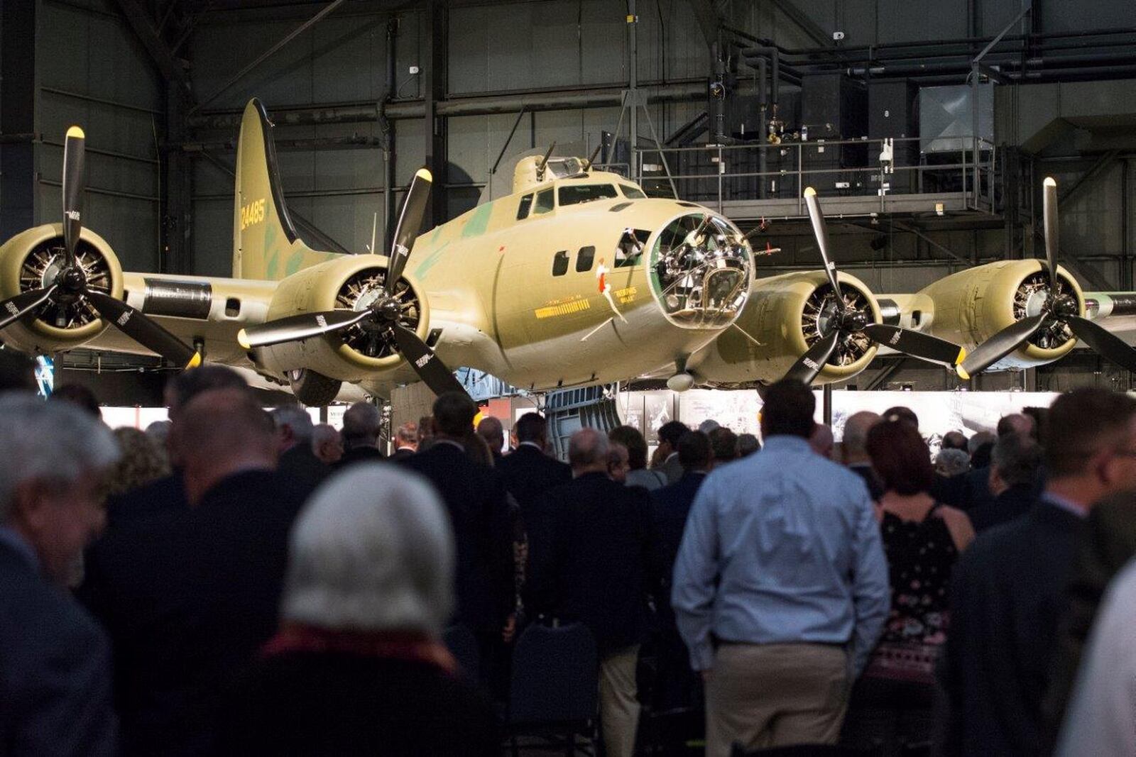 Crowds gather around the B-17F Memphis Belle to get a better look at the conclusion of its unveiling ceremony at the Memphis Belle exhibit inside the National Museum of the U.S. Air Force, Wright-Patterson Air Force Base, May 16, 2018. The Memphis Belle is the most famous Flying Fortress, having been the first able to return to the United States following 25 combat missions over occupied Europe during World War II. (U.S. Air Force photo/Wesley Farnsworth)