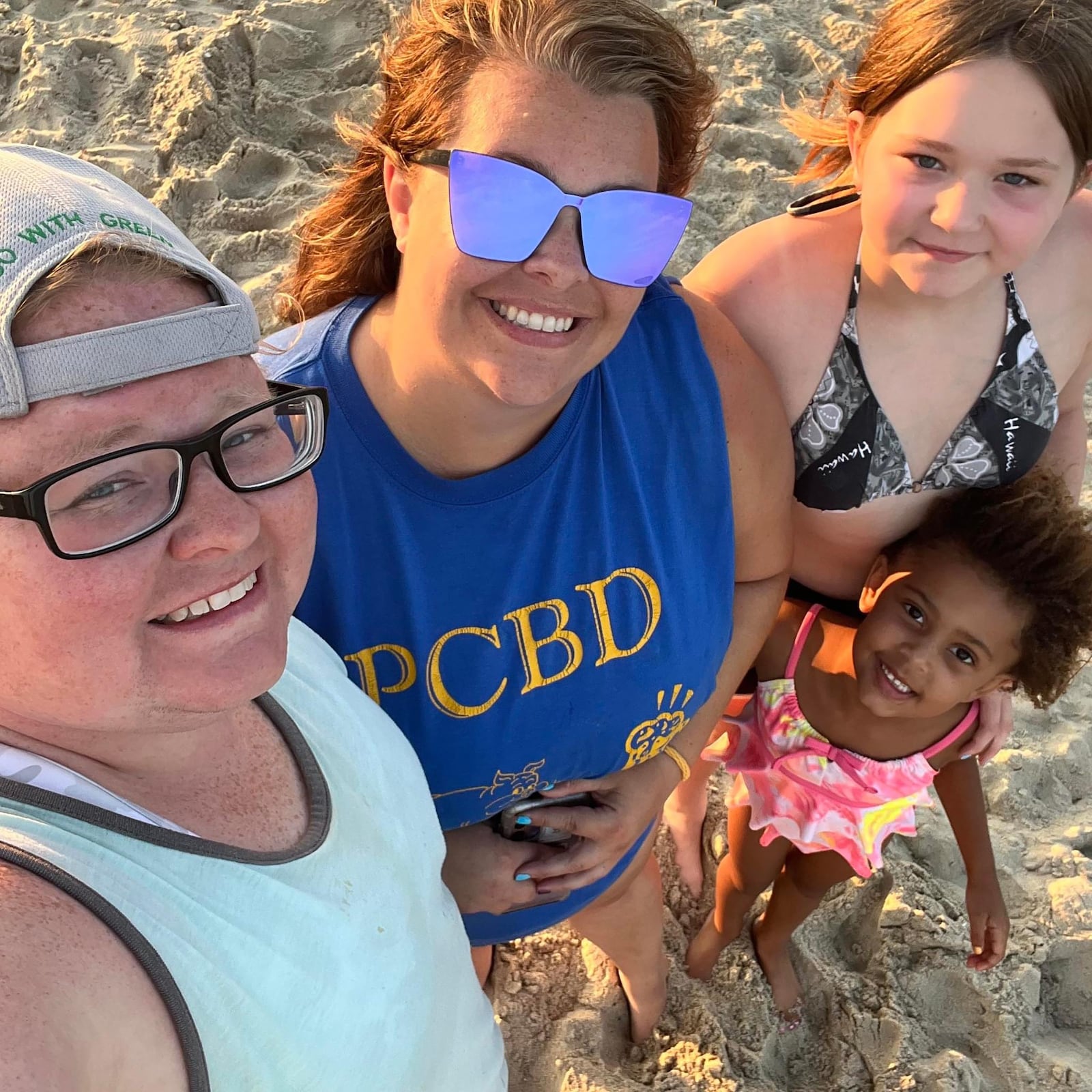 Tilton (L) with her family on vacation at the beach. L-R Tilton, partner Whitney Hartman, younger sibling Leia Tilton and daughter Kenlee Hartman.