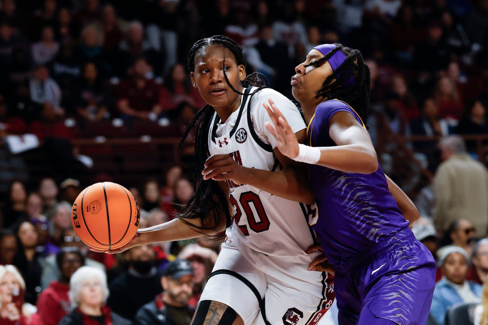 South Carolina forward Sania Feagin, left, drives against LSU forward Sa'Myah Smith, right, during the first half of an NCAA college basketball game in Columbia, S.C., Friday, Jan. 24, 2025. (AP Photo/Nell Redmond)