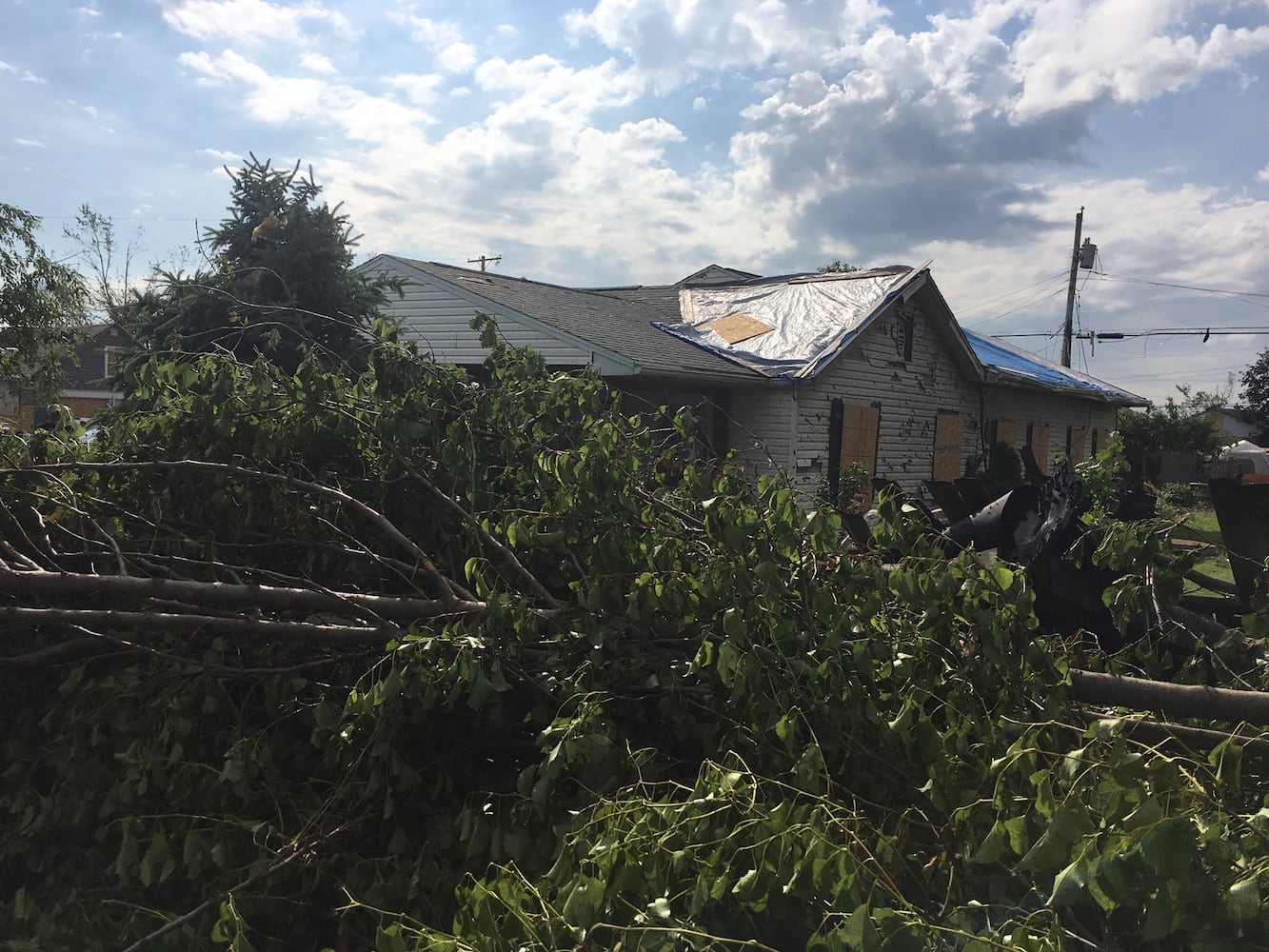 PHOTOS: Tornado-damaged communities dig out, clean up