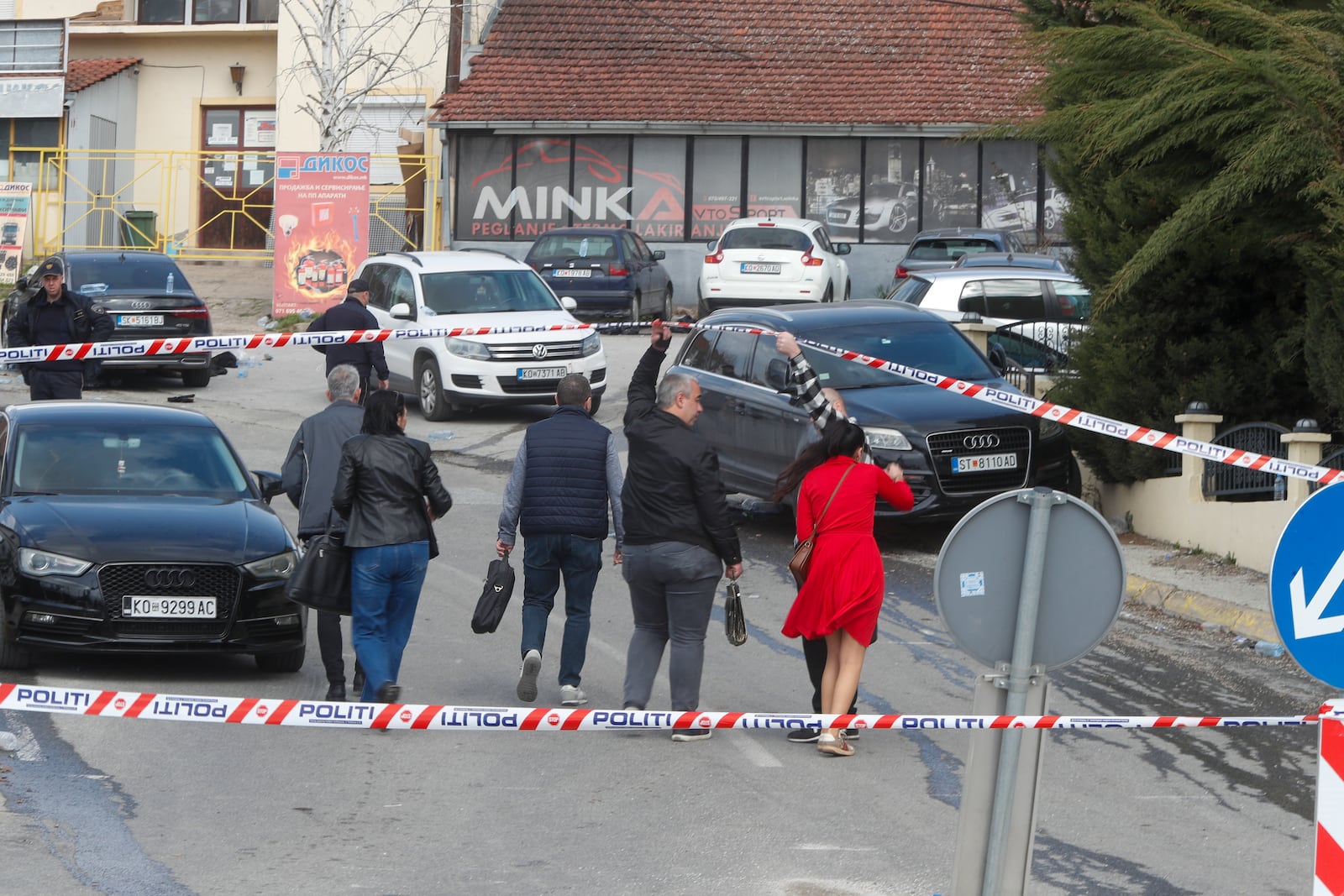 Prosecutors arrive at the scene of a massive fire in a nightclub in the town of Kocani, North Macedonia, Sunday, March 16, 2025. (AP Photo/Boris Grdanoski)