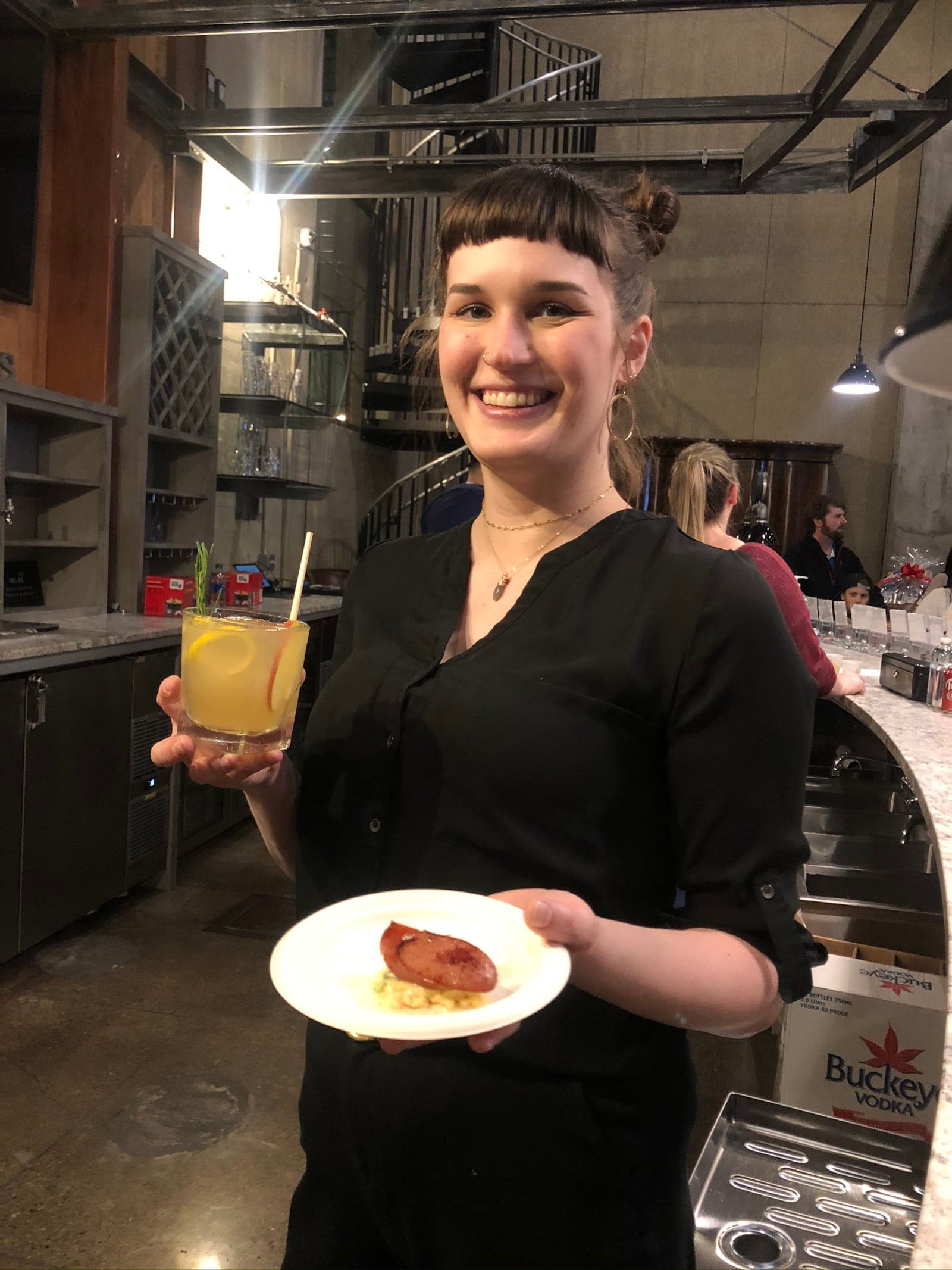 Chef Elizabeth Wiley and her team from Meadowlark paired a house-made pimento cheese with smoked sausage on a cracker with bartender Carolyn Porter's "An Apple A Day." AMELIA ROBINSON/STAFF