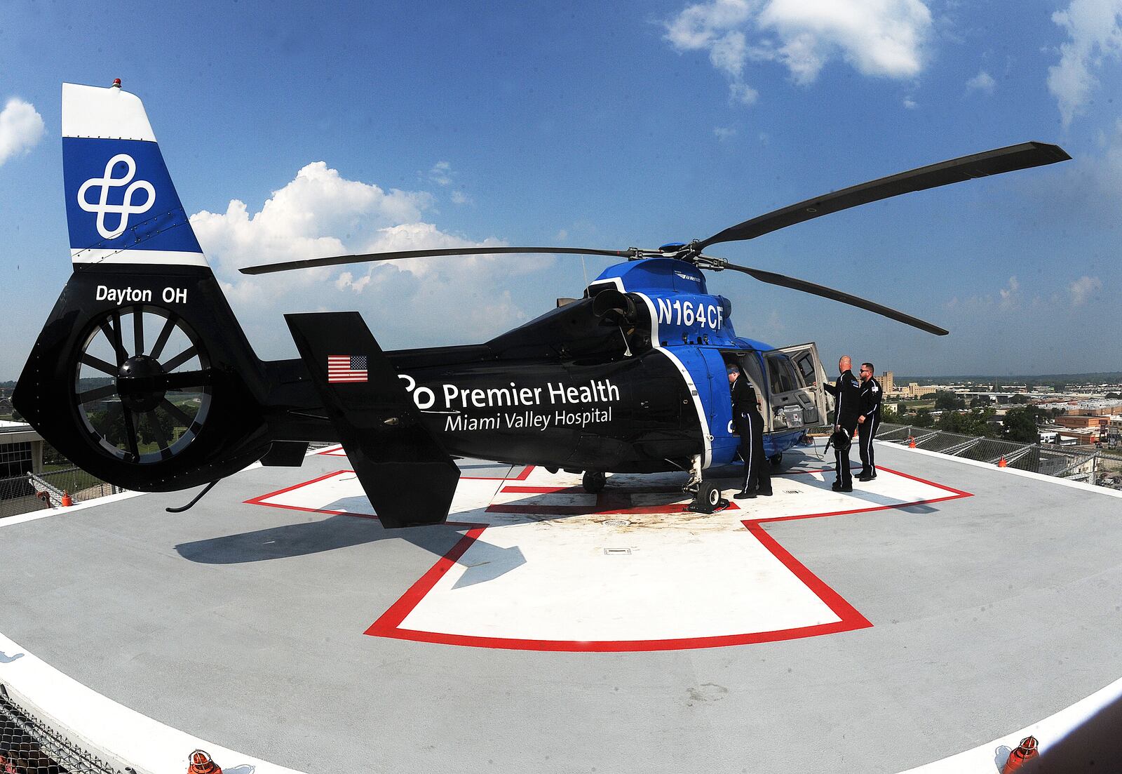 The CareFlight crew prepares for a flight off the south pad atop Miami Valley Hospital Wednesday, July 5, 2023. MARSHALL GORBY\STAFF