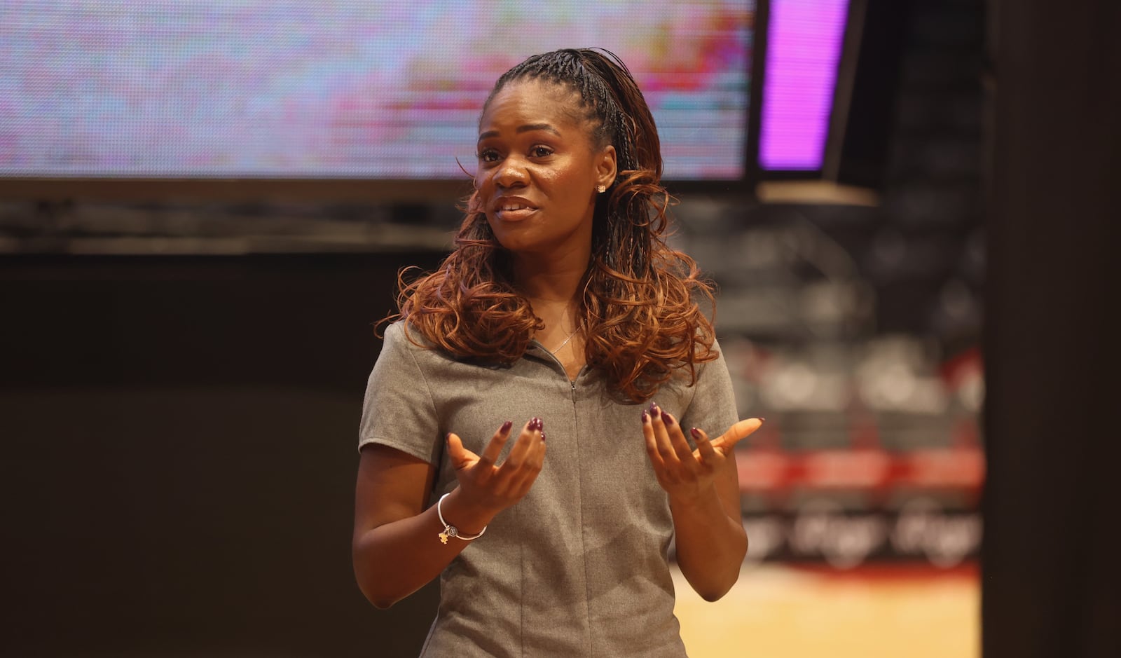 Gloria Umanah, of Hope Booth, speaks at The Spotlight Town Hall, a mental health event, on Wednesday, Oct. 9, 2024, at UD Arena in Dayton. David Jablonski/Staff