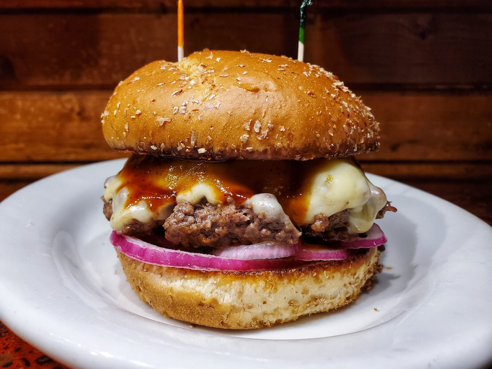 Nick's Restaurant:  a 7oz. Hand spanked beef patty cooked to perfection with pickled red onion, pepper-jack cheese, and topped with house made horseradish bbq sauce.