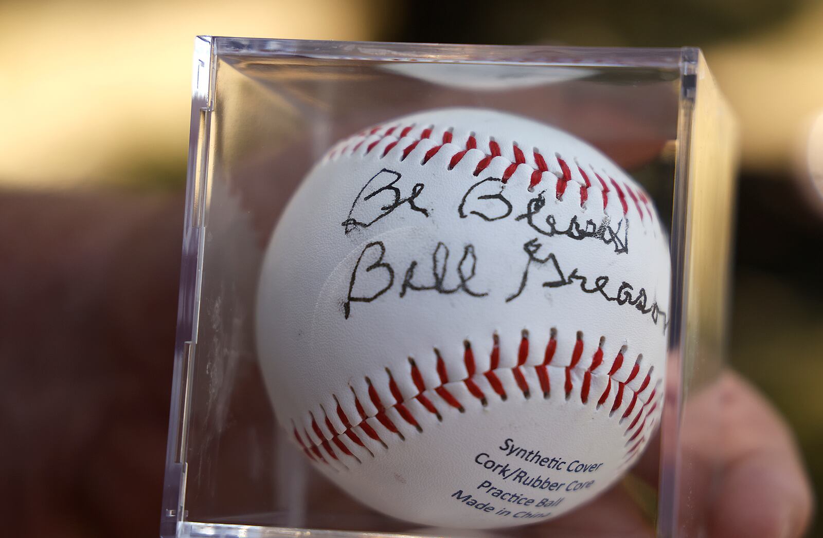 An autographed baseball by Negro League player Bill Greason. BILL LACKEY/STAFF