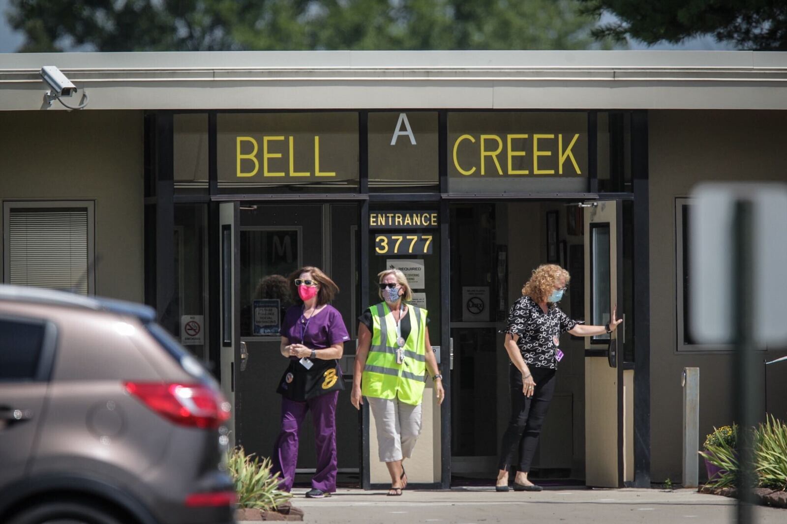 Staff at Bell Creek Intermediate School in Bellbrook prepare for end-of-day dismissal after the first day of classes on Monday, Aug. 17, 2020.