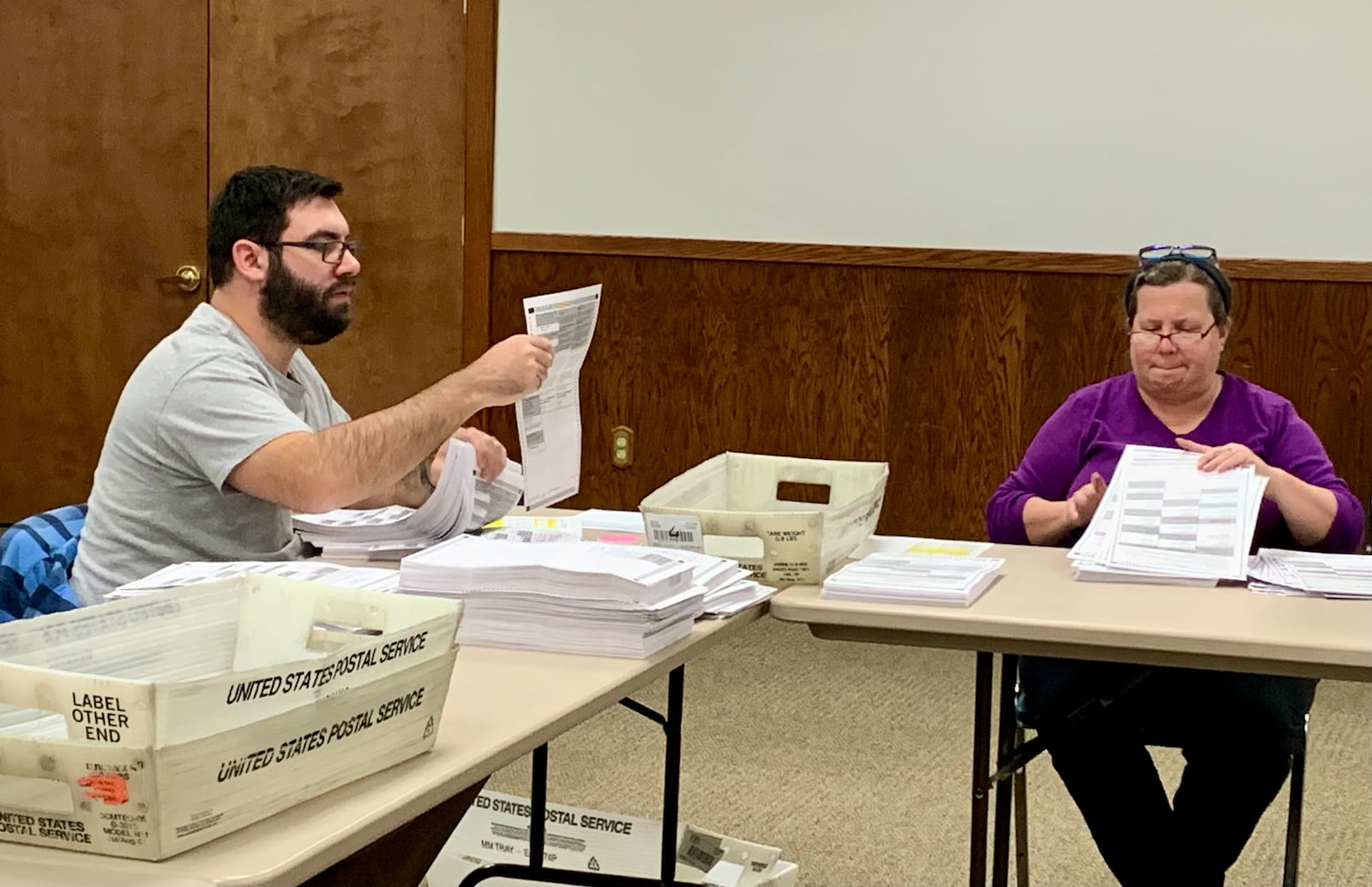 Workers at the Greene County Board of Elections match paper ballots Thursday afternoon. LONDON BISHOP/STAFF