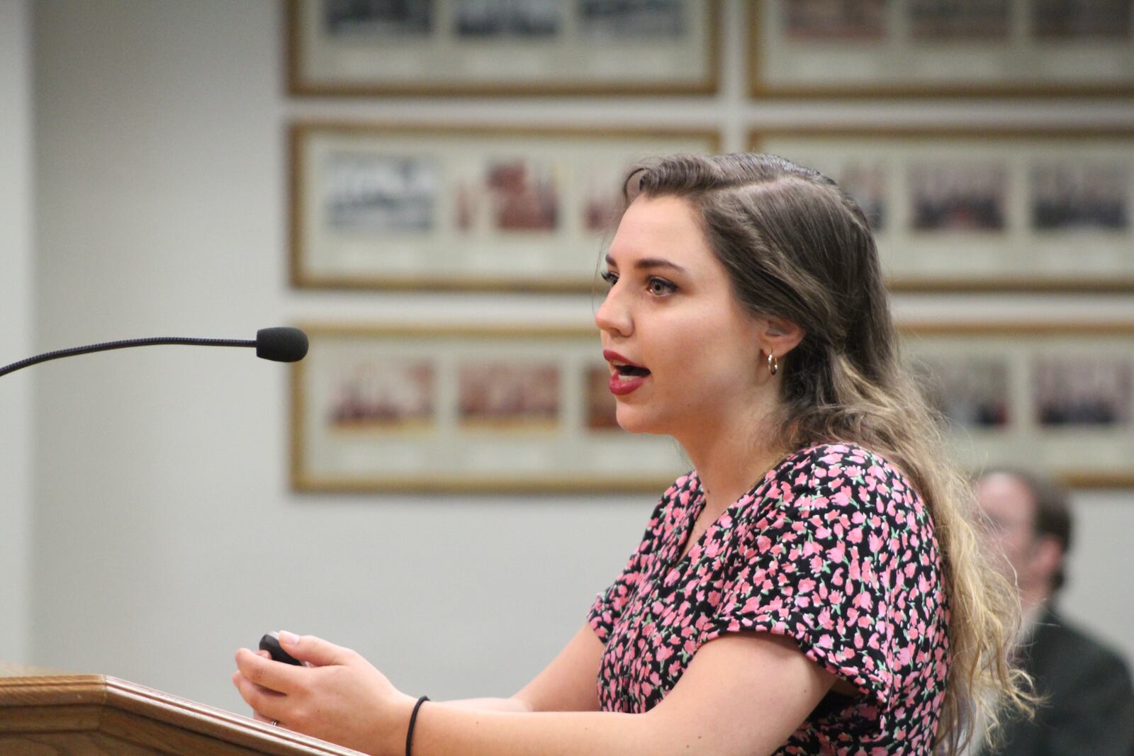 Meg Maloney, a sustainability specialist with the city of Dayton, speaks at a city commission meeting about energy aggregation. CORNELIUS FROLIK / STAFF