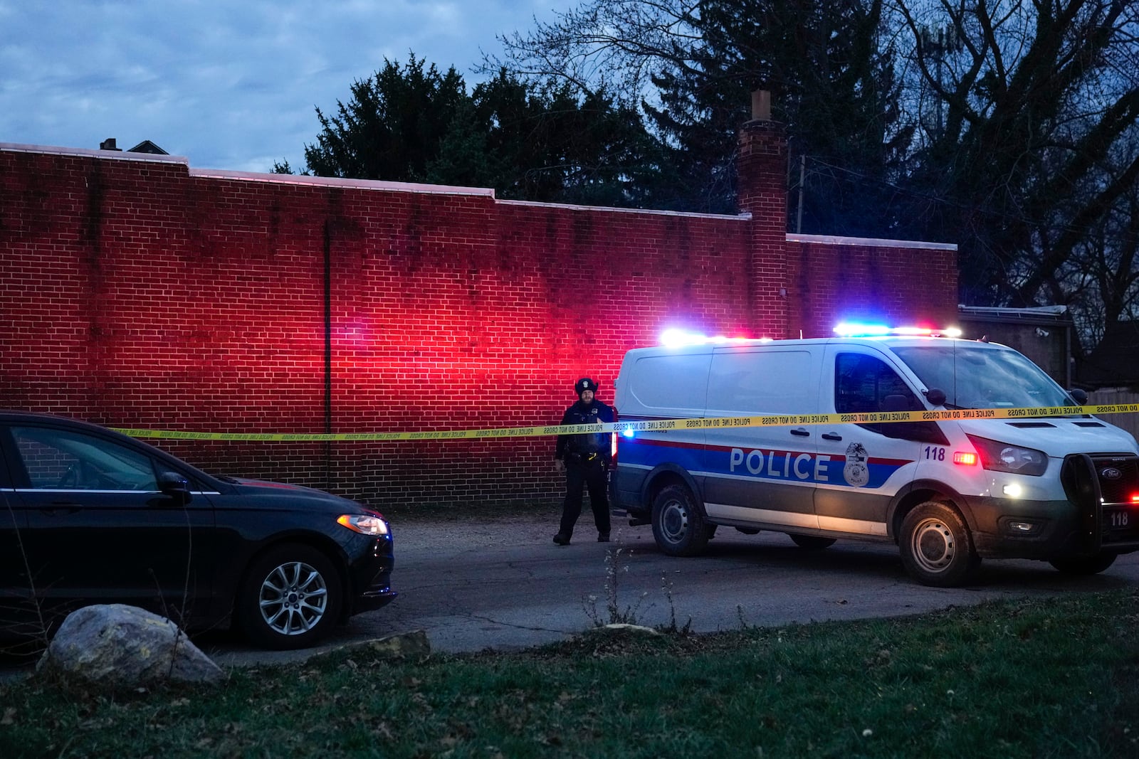 Columbus Police Department investigate the scene of a homicide on South Ohio Avenue as seen from the intersection of East Mithoff Street and South Ohio Avenue on Saturday, Dec. 14, 2024, in Columbus, Ohio. (Samantha Madar/The Columbus Dispatch via AP)