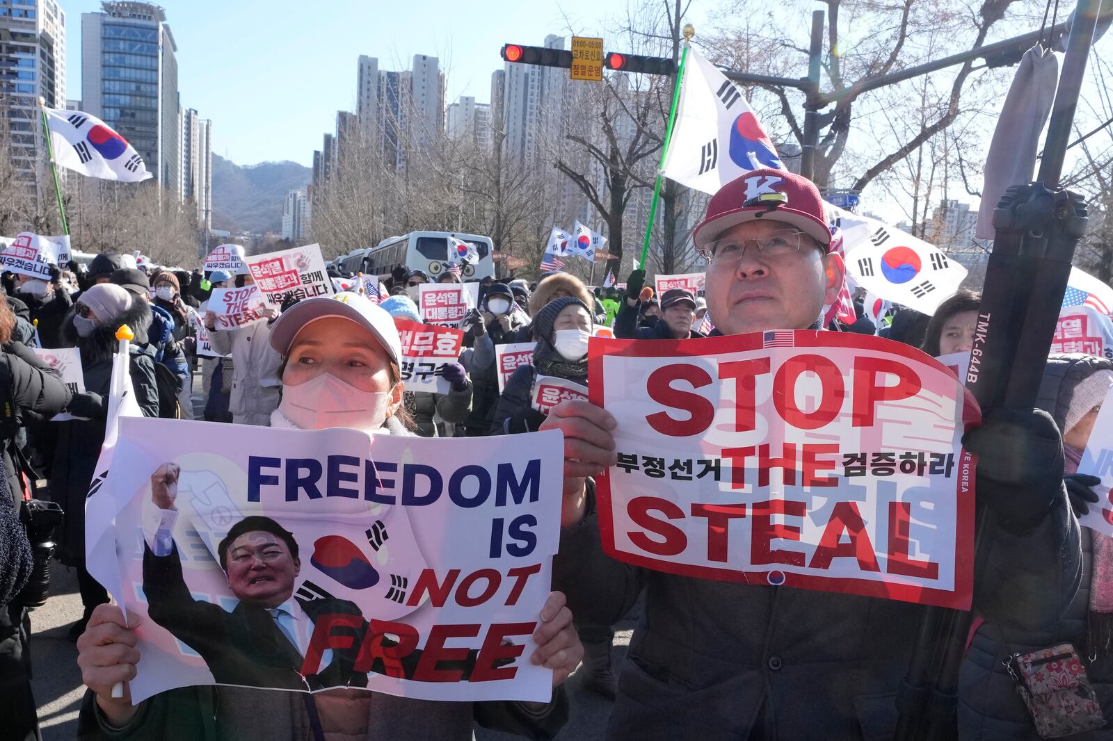 Supporters of impeached South Korean President Yoon Suk Yeol attend a rally to oppose his impeachment near the Corruption Investigation Office for High-Ranking Officials in Gwacheon, South Korea, Wednesday, Jan. 15, 2025. (AP Photo/Ahn Young-joon)