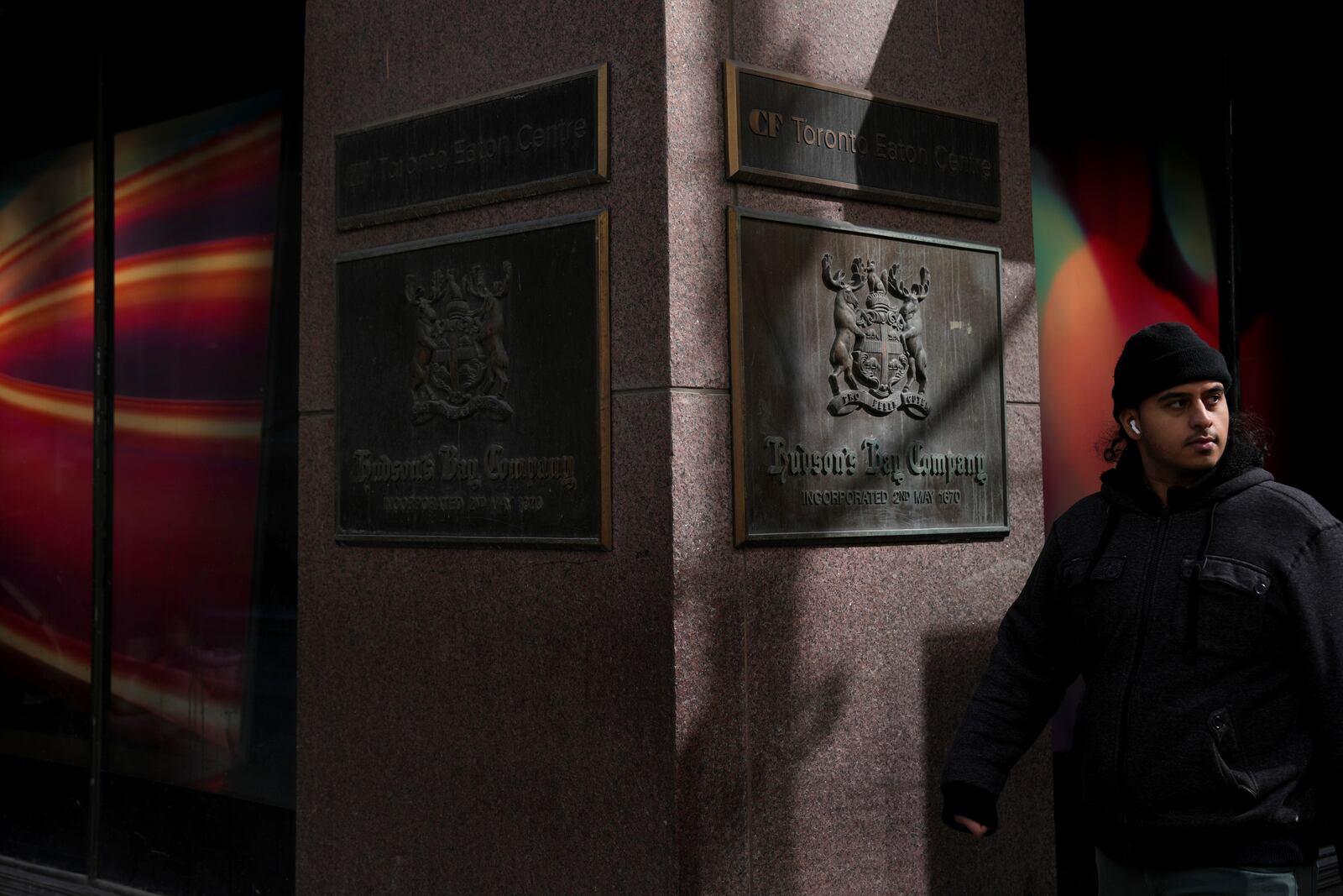 A man walks past the Hudson's Bay store in Toronto, Monday, March 10, 2025. (Chris Young/The Canadian Press via AP)