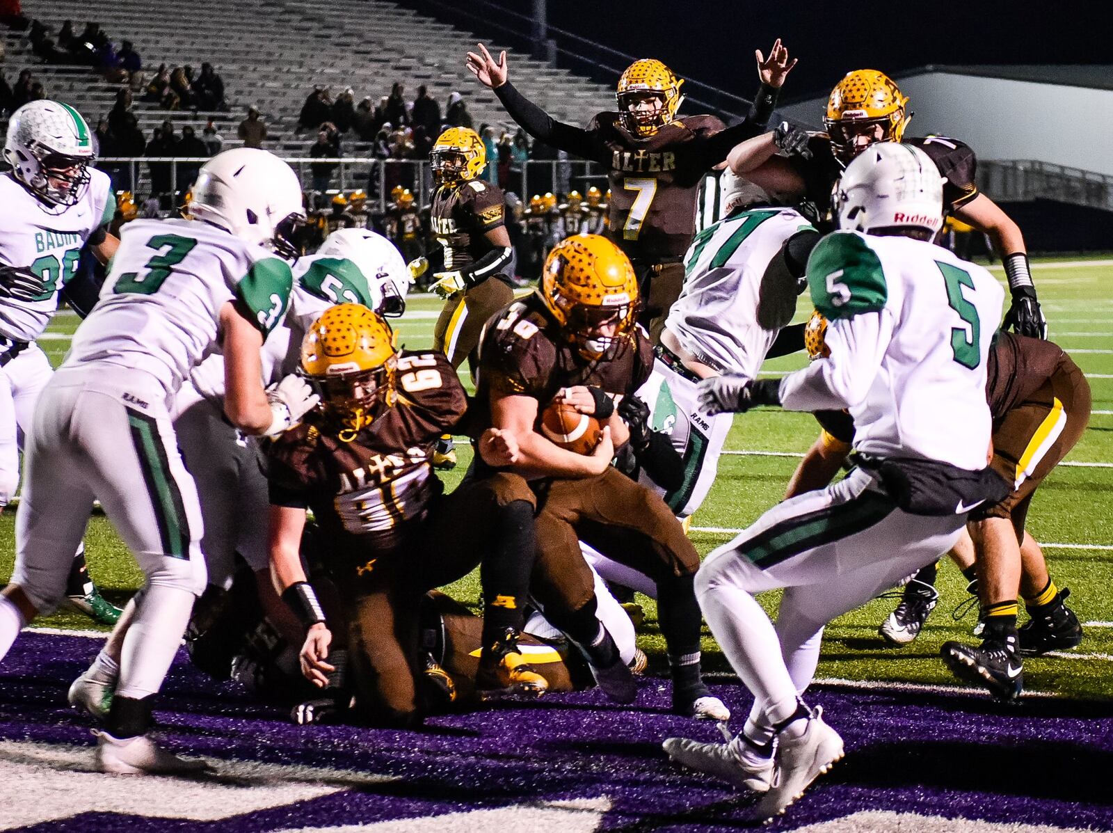 Alter’s Peter Riazzi carries the ball into the end zone for a touchdown during Friday night’s Division III, Region 12 playoff semifinal at Barnitz Stadium in Middletown. NICK GRAHAM/STAFF