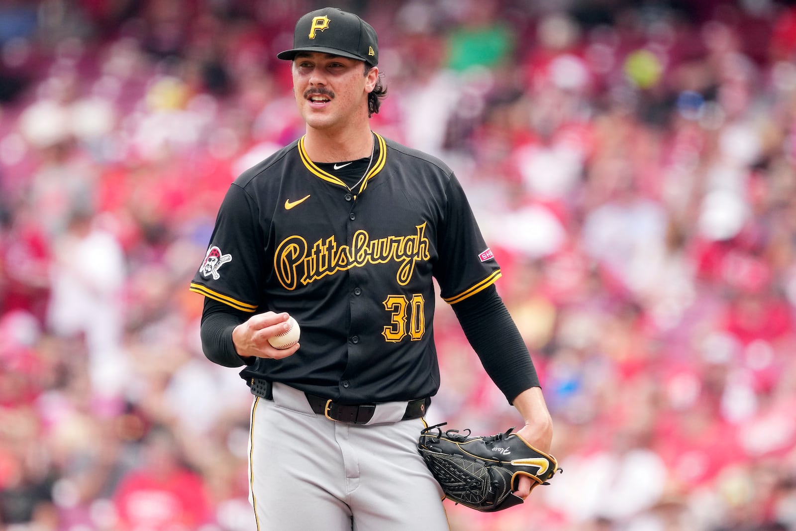 FILE - Pittsburgh Pirates' Paul Skenes resets on the mound before delivering a pitch in the fourth inning of a baseball game against the Cincinnati Reds, Sunday, Sept. 22, 2024, in Cincinnati. (AP Photo/Kareem Elgazzar, File)