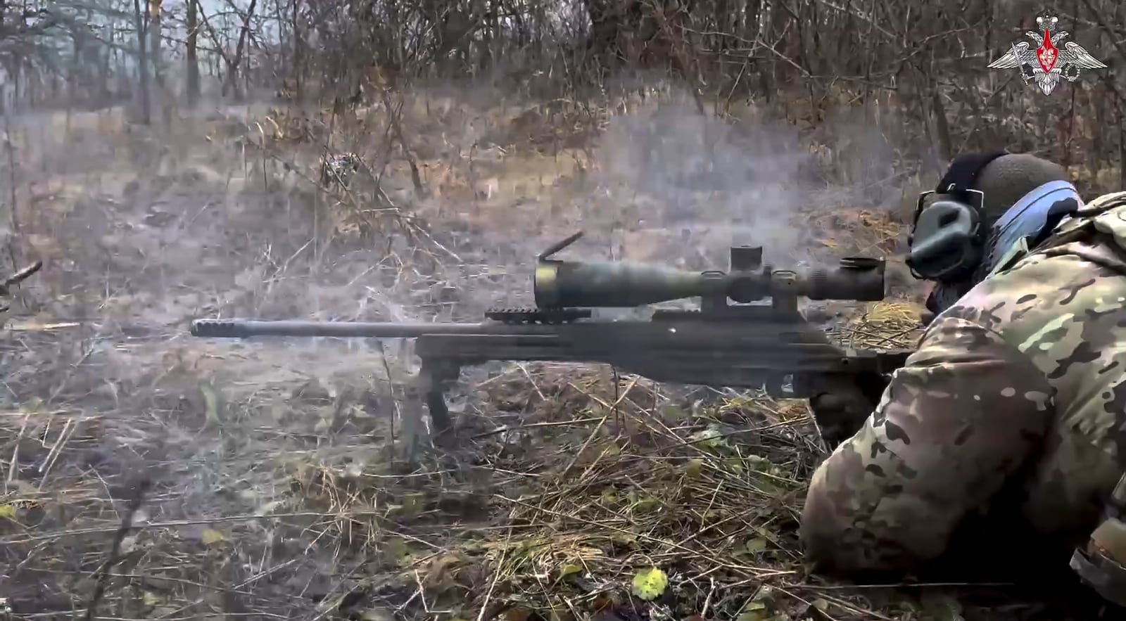 In this photo taken from video distributed by the Russian Defense Ministry Press Service on Saturday, Jan. 11, 2025, a Russian sniper fires towards Ukrainian forces from an undisclosed location. (Russian Defense Ministry Press Service via AP)