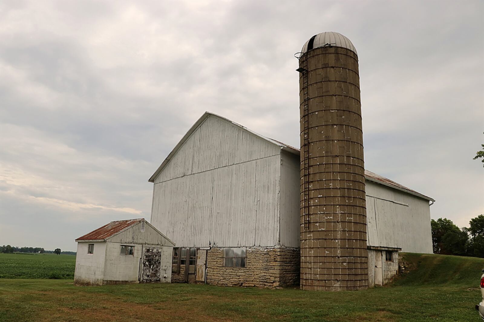 The 2.4-acre property includes a bank barn with silo and a 4-car garage with attached workshop. A garden shed, a chicken coop and a corn crib complete the country setting. CONTRIBUTED PHOTO BY KATHY TYLER