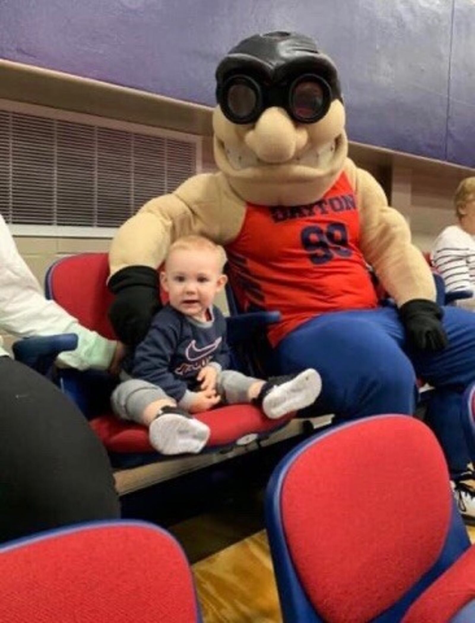 Jamie Peterson’s son Carter with Rudy Flyer at a volleyball match. CONTRIBUTED