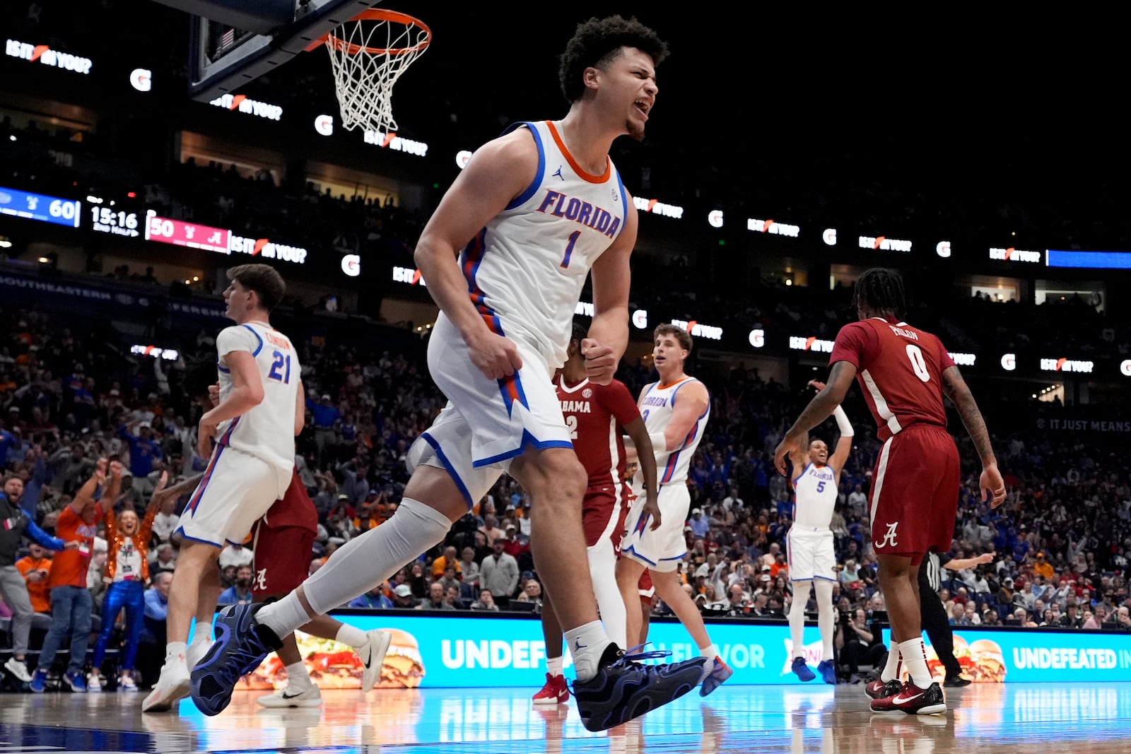 Florida guard Walter Clayton Jr. (1) reacts to a basket against Alabama during the second half of an NCAA college basketball game in the semifinal round of the Southeastern Conference tournament, Saturday, March 15, 2025, in Nashville, Tenn. (AP Photo/George Walker IV)