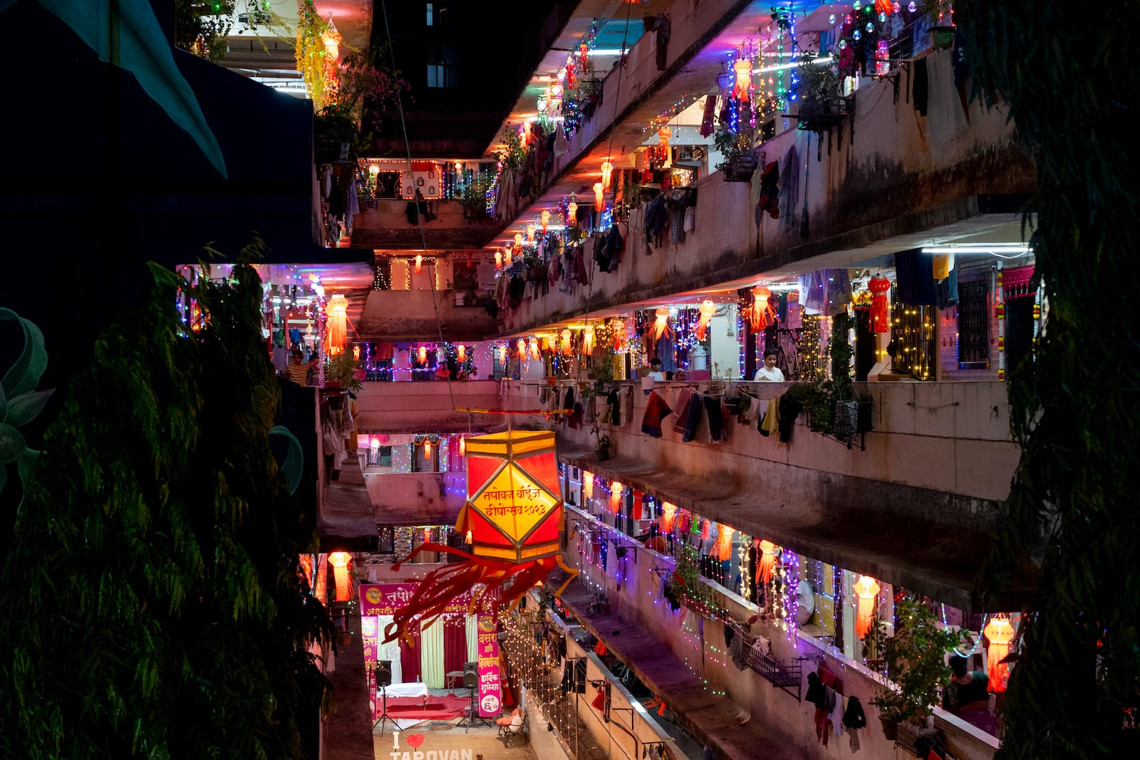 FILE- A residential building is decorated with lanterns and lights during Diwali, the festival of lights in Mumbai, India, Nov. 12, 2023. (AP Photo/Rafiq Maqbool, File)