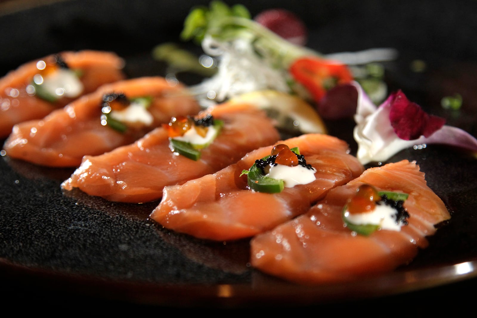 The yuzu salmon appetizer at Ozu 852 is made with black and ikura caviar. Ozu 852 is a repeat winner of the Best Asian Food category in the Best of Dayton contest. The restaurant, located at 852 Union Blvd. in Englewood, is known for fresh, quality sushi, hibachi, Chinese and Japanese foods.  LISA POWELL / STAFF