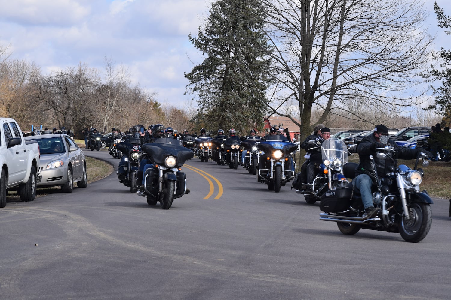 PHOTOS: Thousands of Outlaws attend motorcycle gang leaders funeral at Montgomery County Fairgrounds.