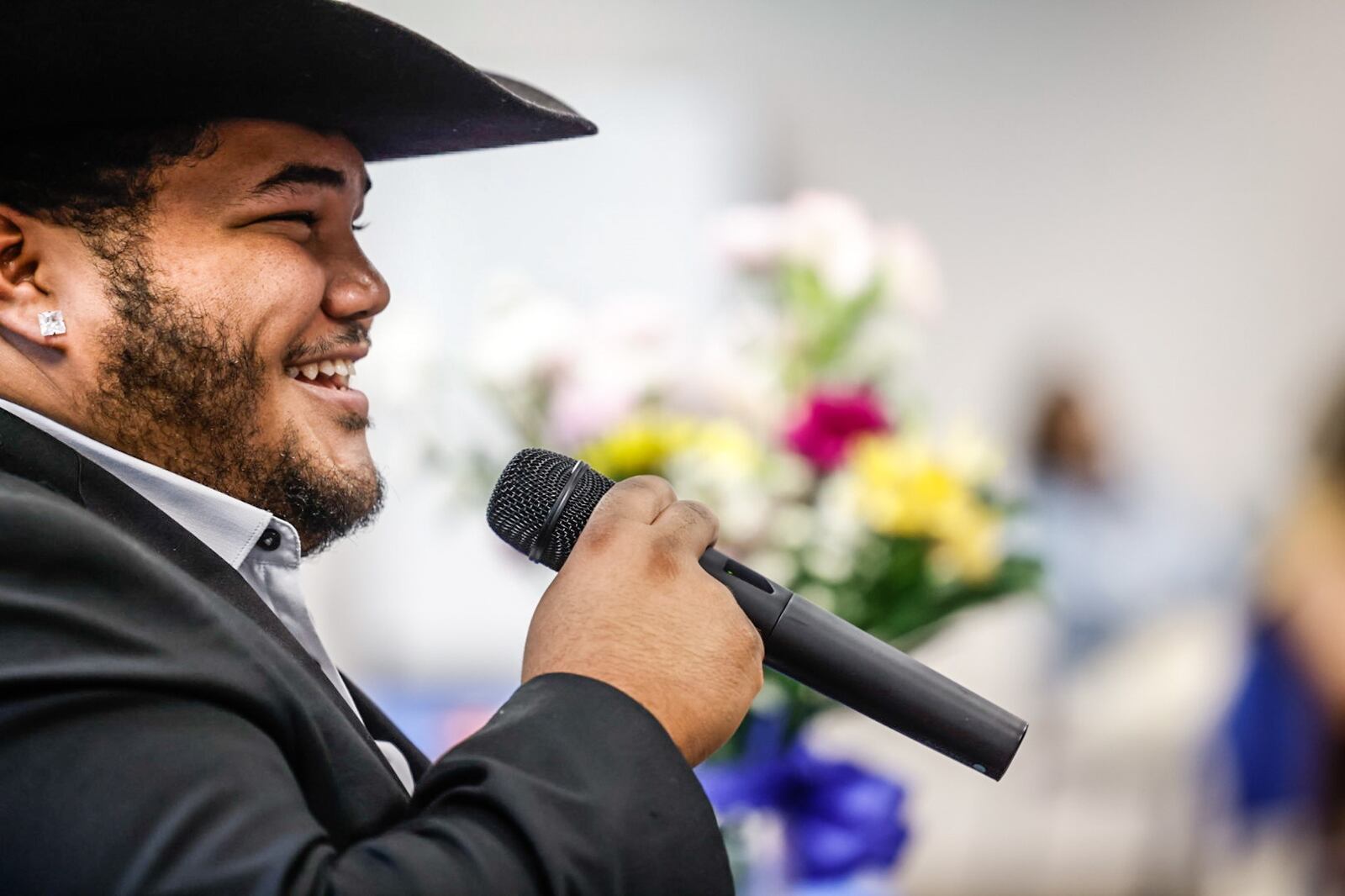 Former Montgomery County foster youth Jackson Snelling sings a song for the Montgomery County Children Services caseworkers Thursday May 23, 2024. Singer songwriter Snelling was adopted from Montgomery County and has appeared on The Voice and American Idol. JIM NOELKER/STAFF