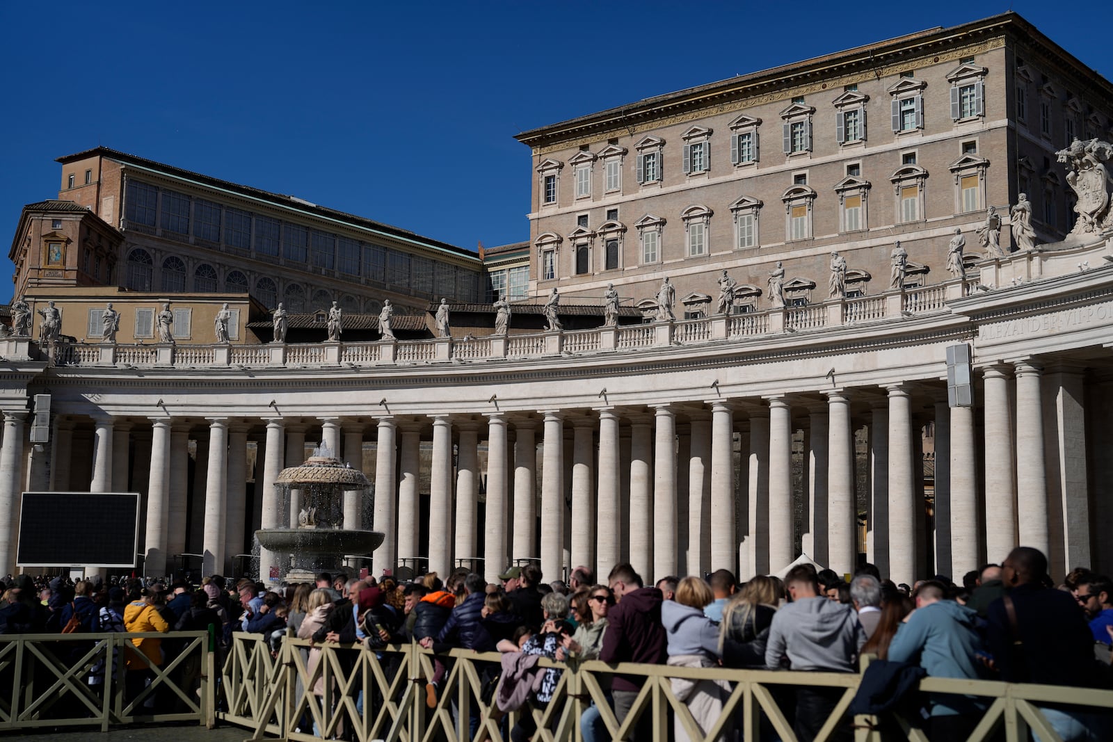 Faithful wait under the closed window of the Apostolic Palace at The Vatican, Sunday, Feb. 16, 2025, from where Pope Francis, who was hospitalised on Friday, blesses the faithful gathered in St. Peter's Square after the Angelus every Sunday. (AP Photo/Gregorio Borgia)