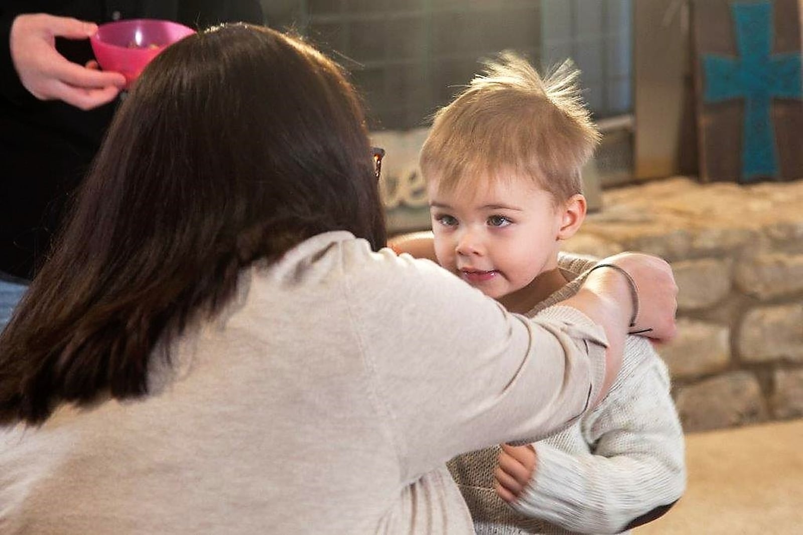 Cyndi Swafford of Englewood, helps her adopted son Judah. He was born addicted to drugs and came to the Swafford family as a foster child. MICHAEL BURIANEK/STAFF