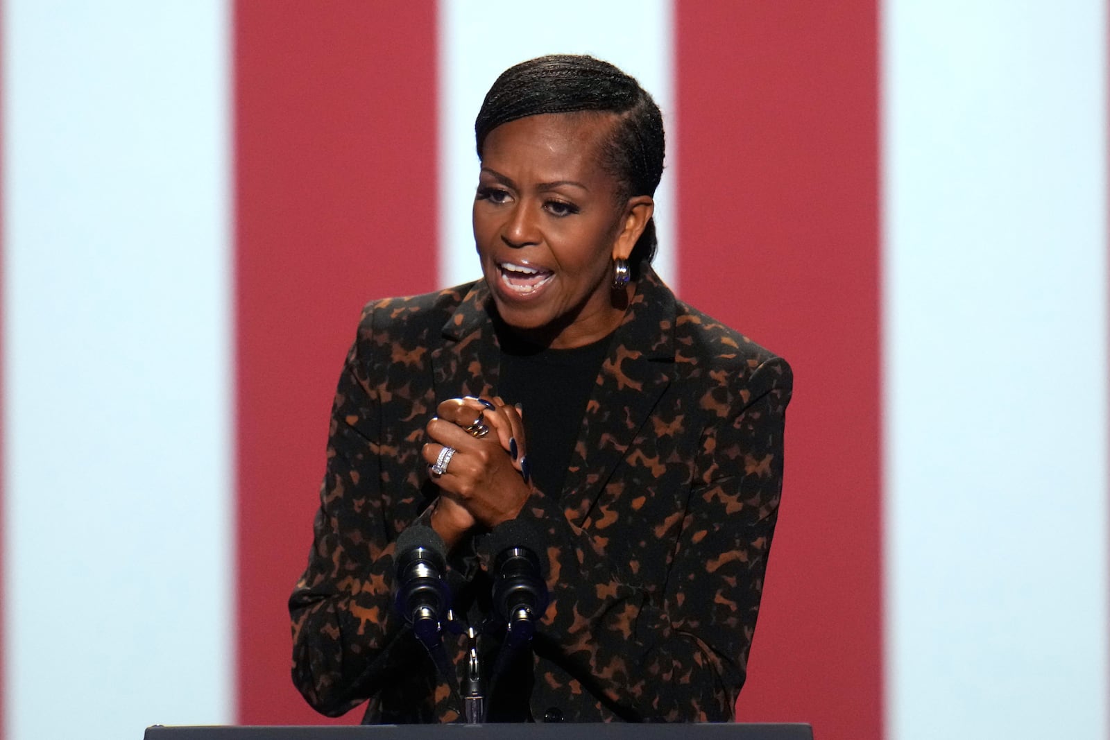 Former first lady Michelle Obama speaks at a campaign rally for democratic presidential nominee Vice President Kamala Harris at the Wings Event Center, in Kalamazoo, Mich., Saturday, Oct. 26, 2024. (AP Photo/Paul Sancya)