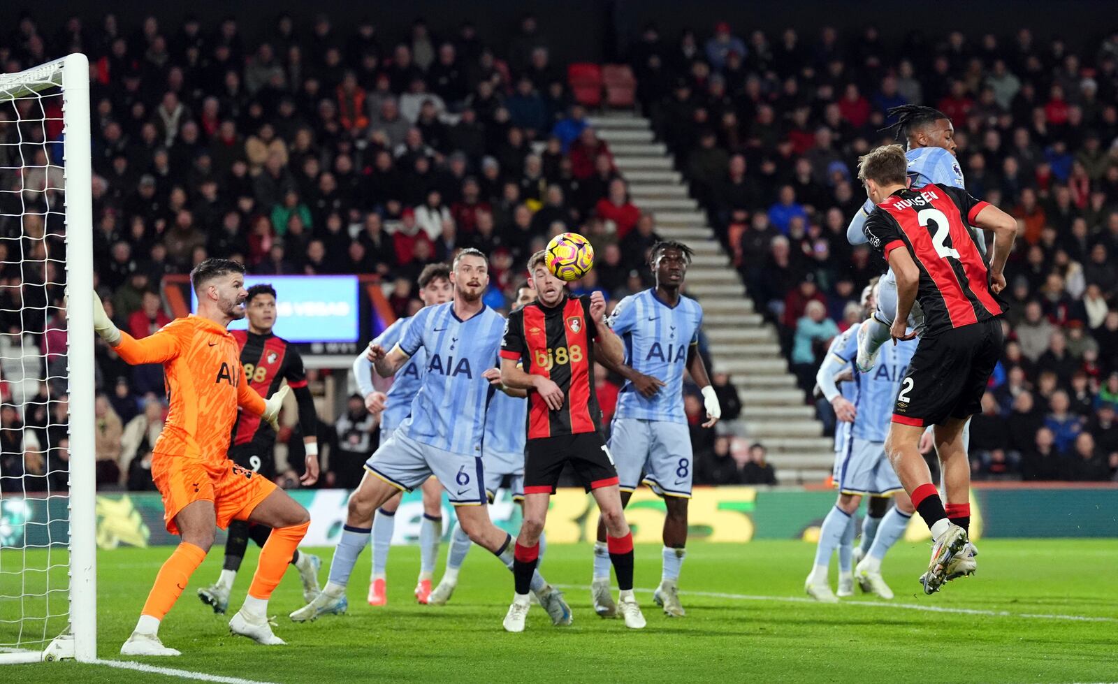 Bournemouth's Dean Huijsen, right, scores the opening goal during during the English Premier League soccer match between AFC Bournemouth and Tottenham Hotspur in Bournemouth, England, Thursday, Dec. 5, 2024. (Adam Davy/PA via AP)