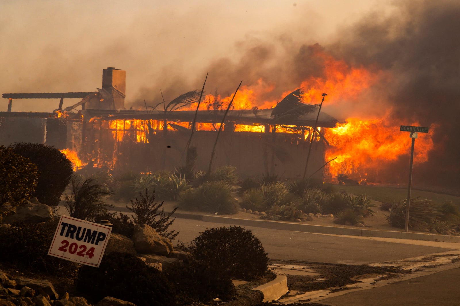 A home burns in the Mountain fire, Wednesday, Nov. 6, 2024, near Camarillo, Calif. (AP Photo/Ethan Swope)