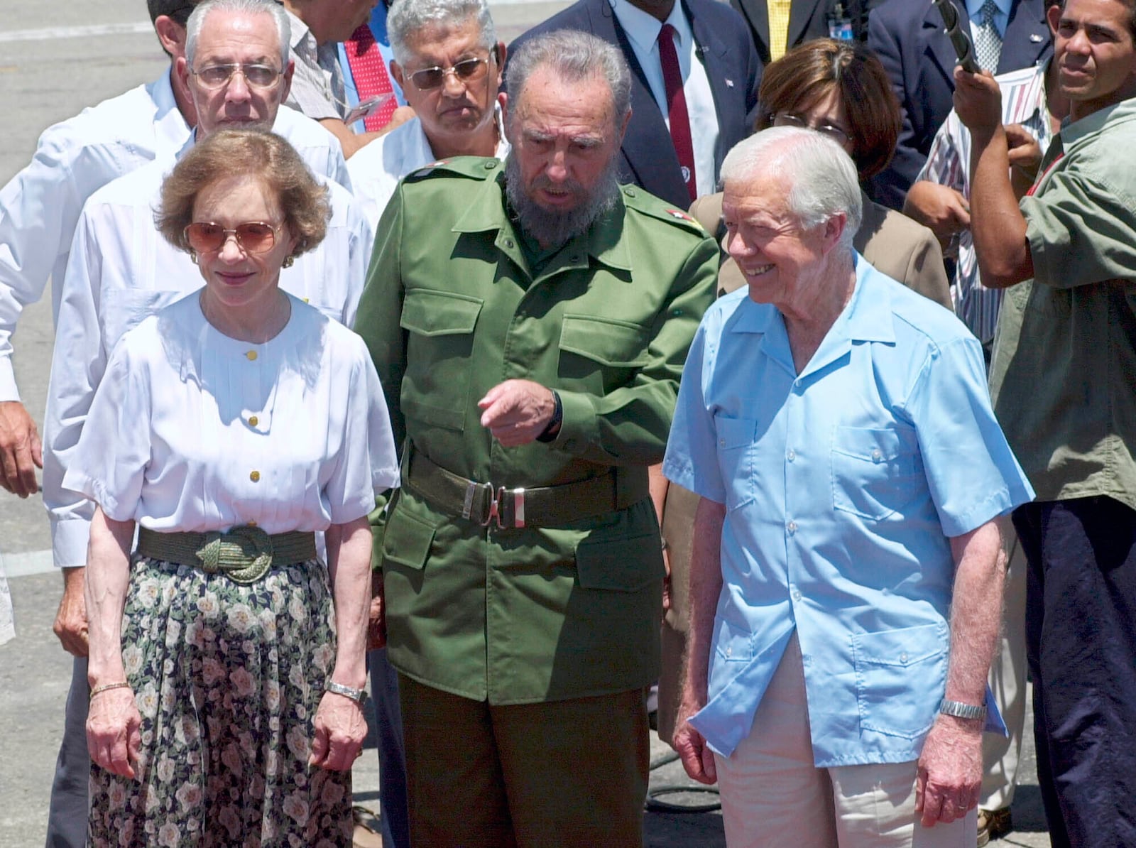 FILE - Former President Jimmy Carter, right, and his wife Rosalynn, left, meet with Cuban leader Fidel Castro at the airport in Havana, Cuba, May 17, 2002. (AP Photo/Gregory Bull, File)