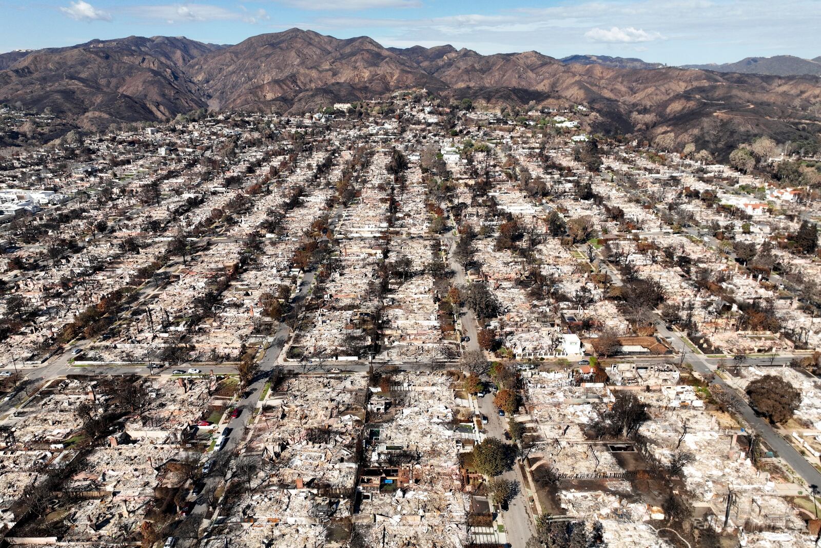 FILE - The devastation from the Palisades Fire is visible in the Pacific Palisades neighborhood of Los Angeles, Jan. 27, 2025. (AP Photo/Jae C. Hong, File)