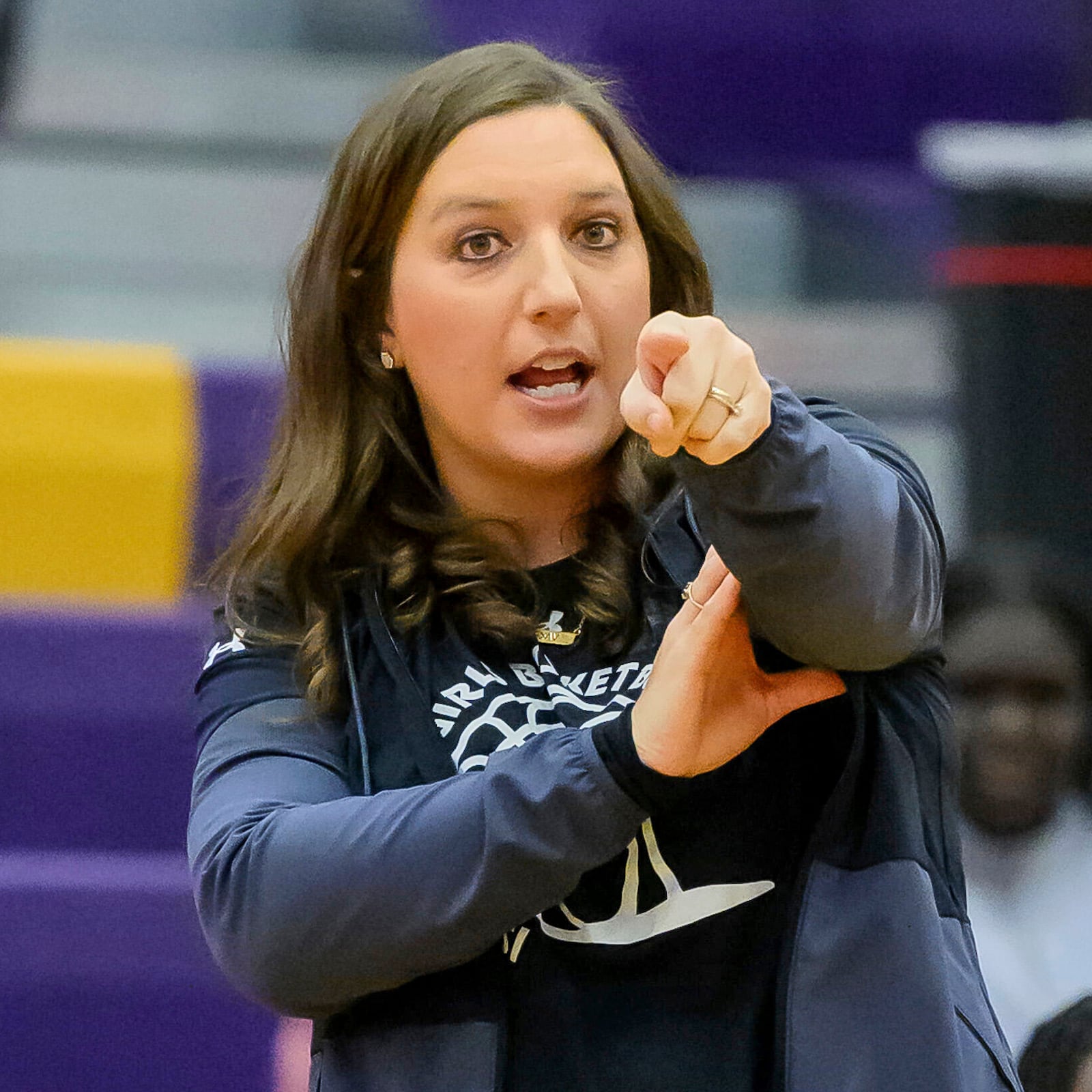 Grand Island High School coach Kathryn Langrehr points during a girls high school basketball game against Norfolk High School, Jan. 26, 2024 in Grand Island, Neb. (Jimmy Rash/The Independent via AP)