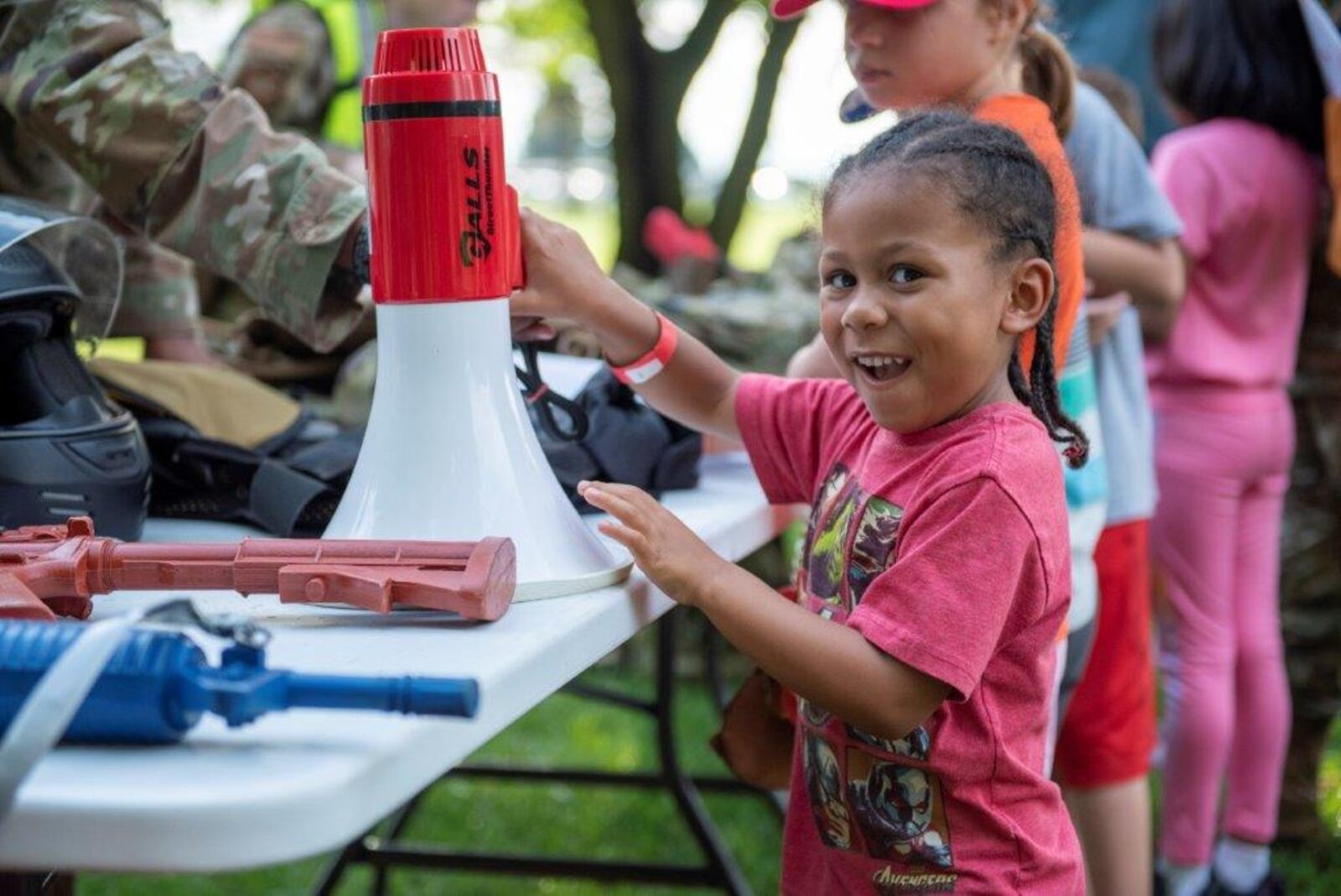 Desmond Jackson, 4, checks out all the tools and equipment brought from the 88th Security Forces Squadron during the Kids Understanding Deployment Operations event Aug. 5 at Bass Lake. U.S. AIR FORCE PHOTO/SENIOR AIRMAN JACK GARDNER