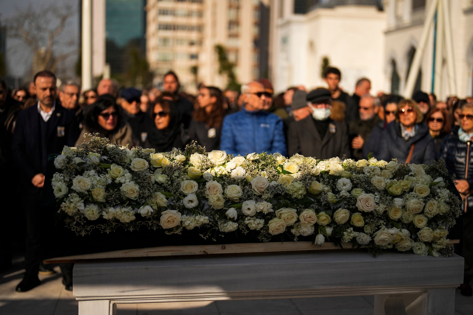 Relatives and friends attend the funeral of three members of the Inal family, who died in a fire that broke out at the Kartalkaya ski resort, at the Barbaros Hayreddin Pasa mosque in Istanbul, Turkey, Friday, Jan. 24, 2025. (AP Photo/Francisco Seco)