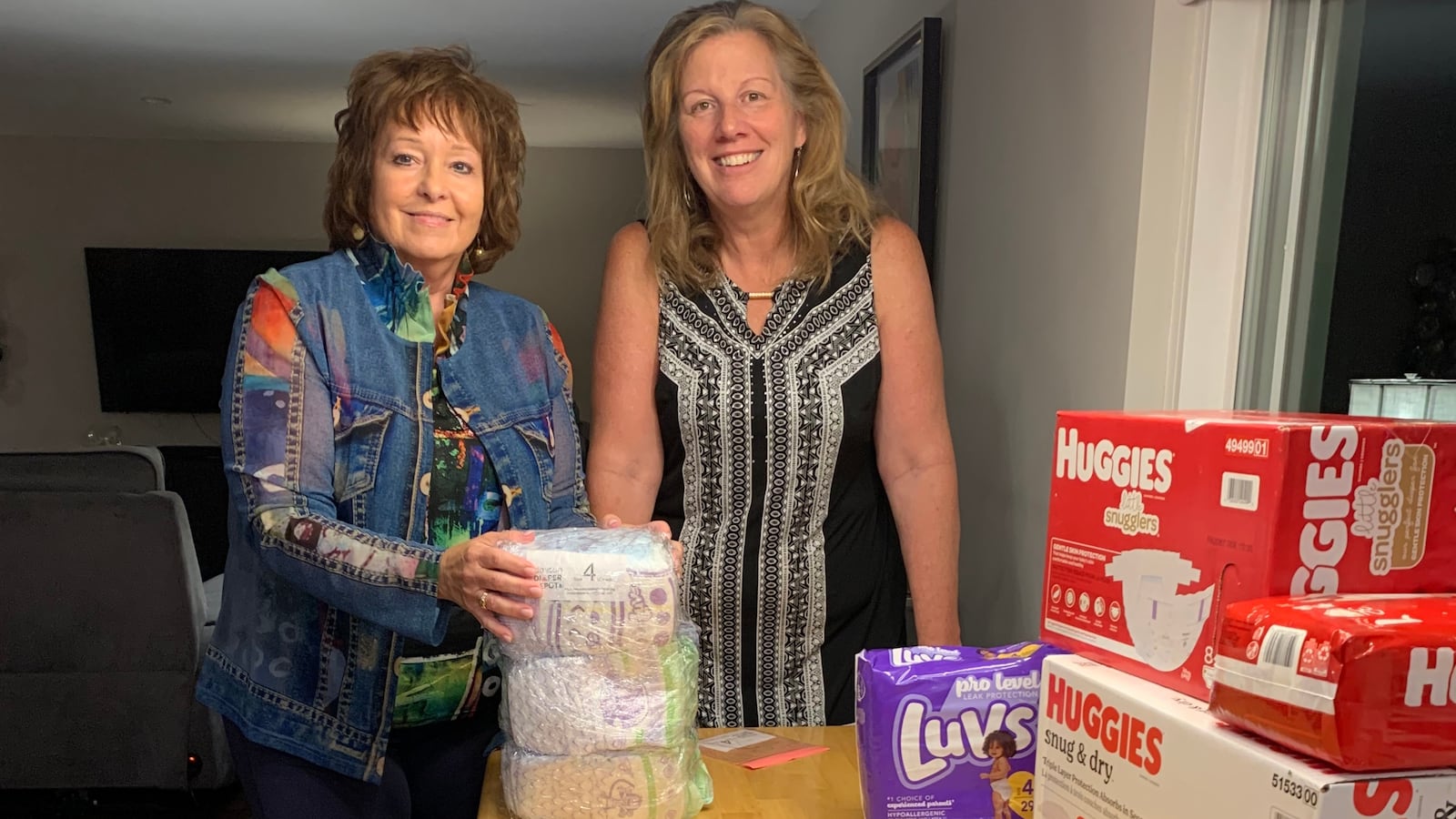 Maggie Schneemann, right, with Dayton Diaper Depot board member Doris Bonomini