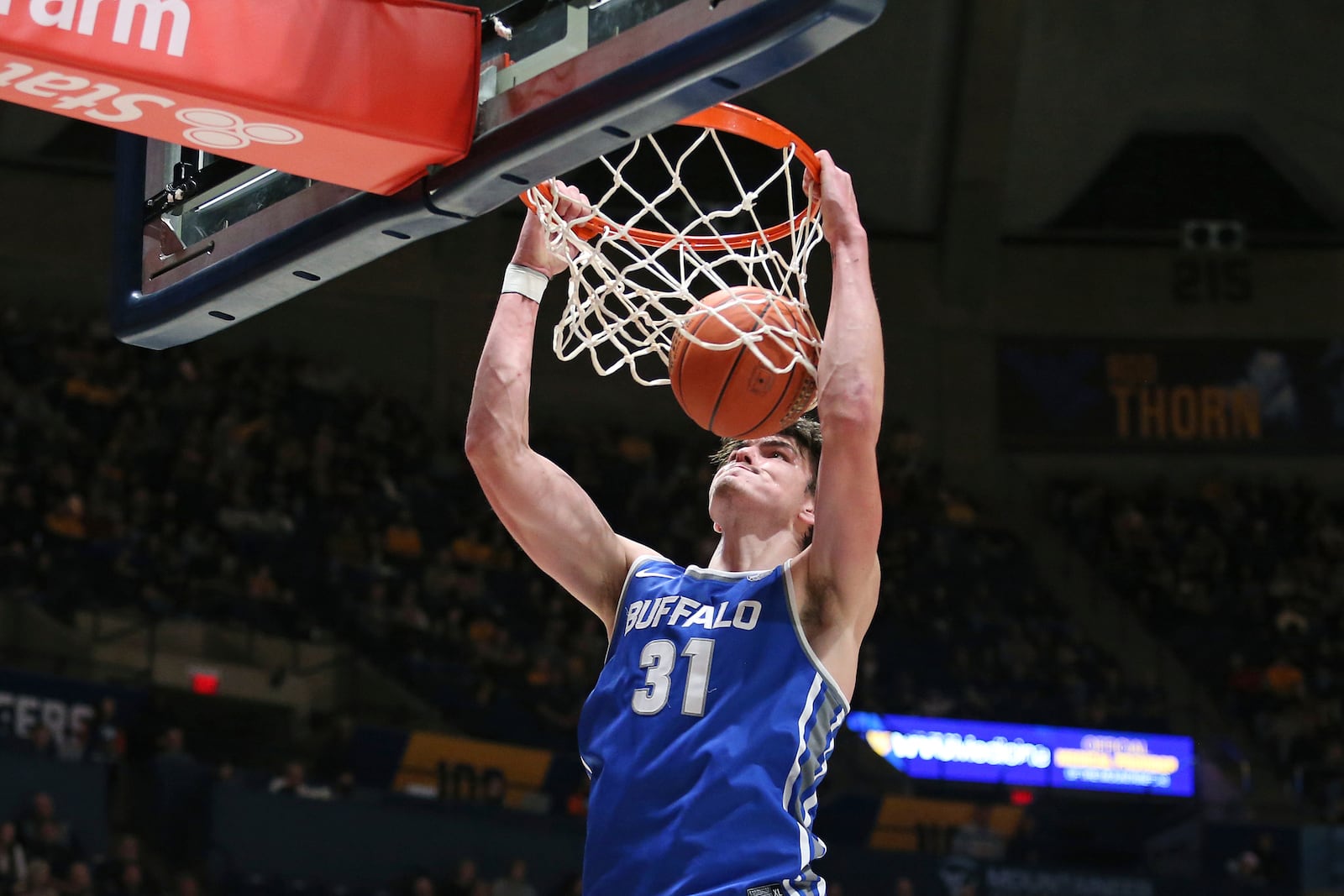 Buffalo center Isaac Jack dunks against West Virginia during the first half of an NCAA college basketball game in Morgantown, W.Va., Sunday, Dec. 18, 2022. (AP Photo/Kathleen Batten)